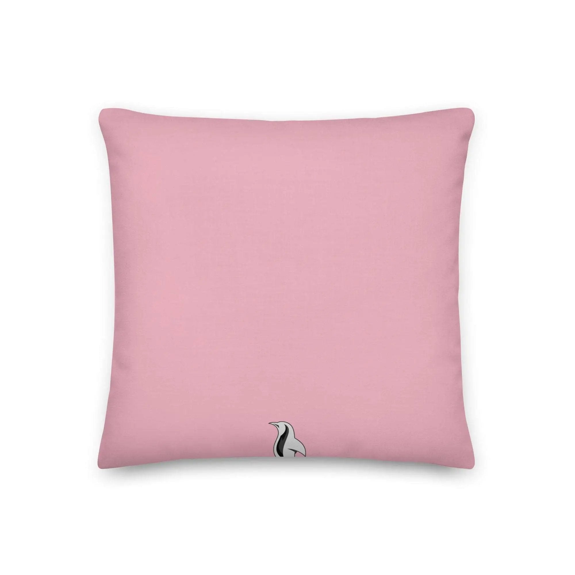 a pink pillow with a black and white cat on it