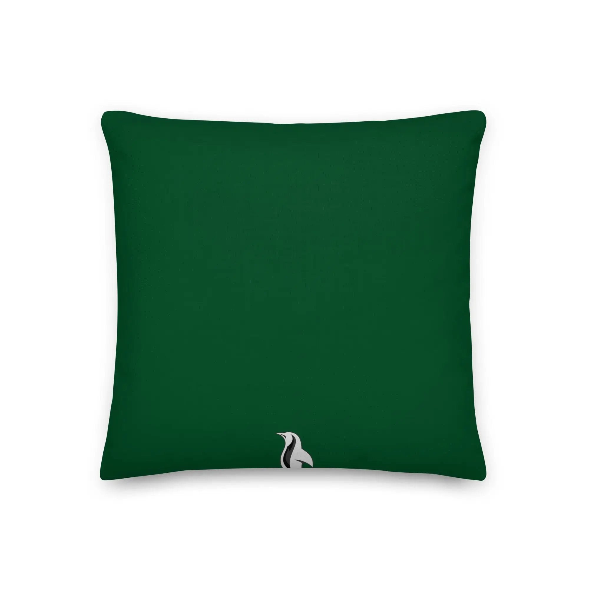 a green pillow with a white bird on it