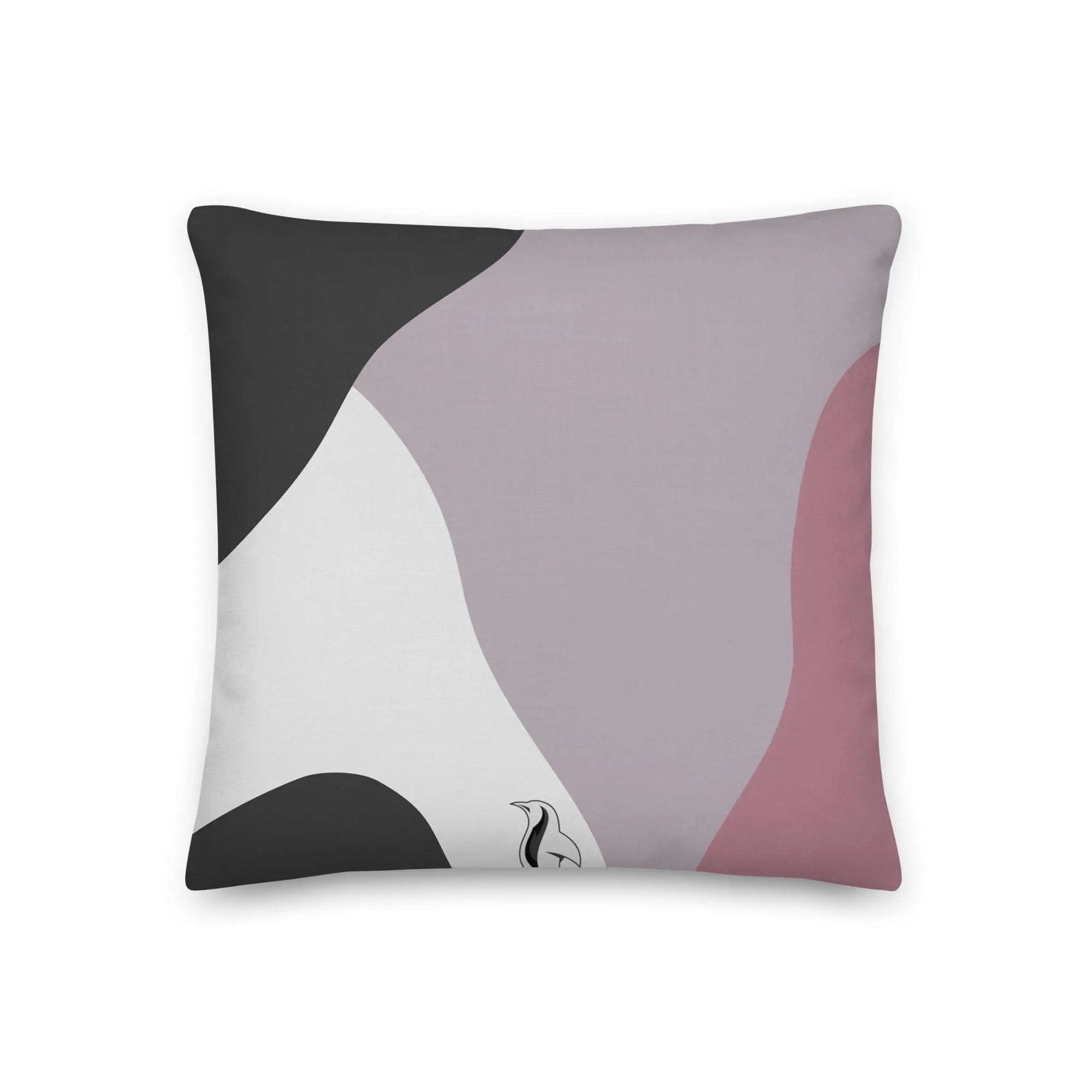 a black and white pillow with a pink and grey design