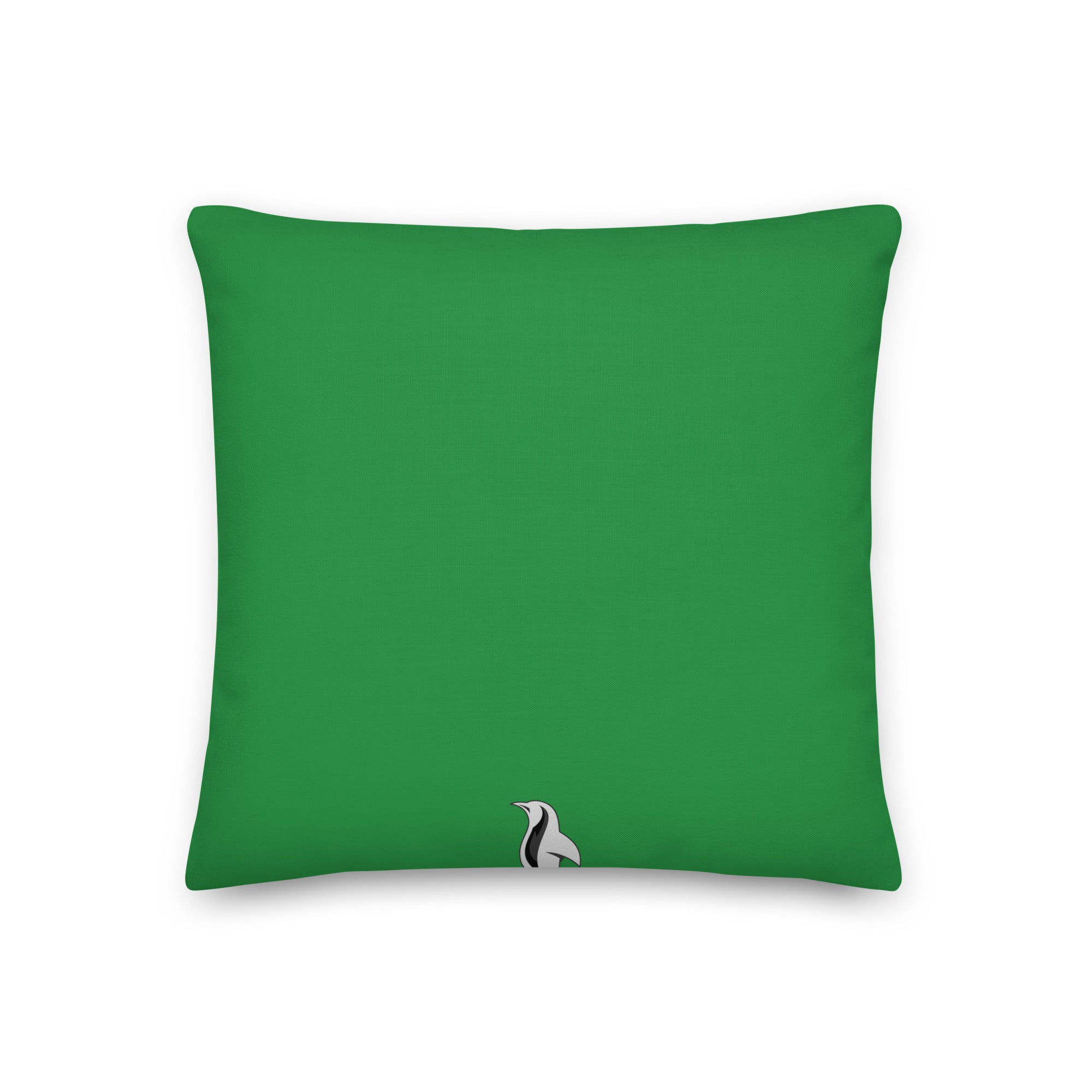 a green pillow with a black and white bird on it