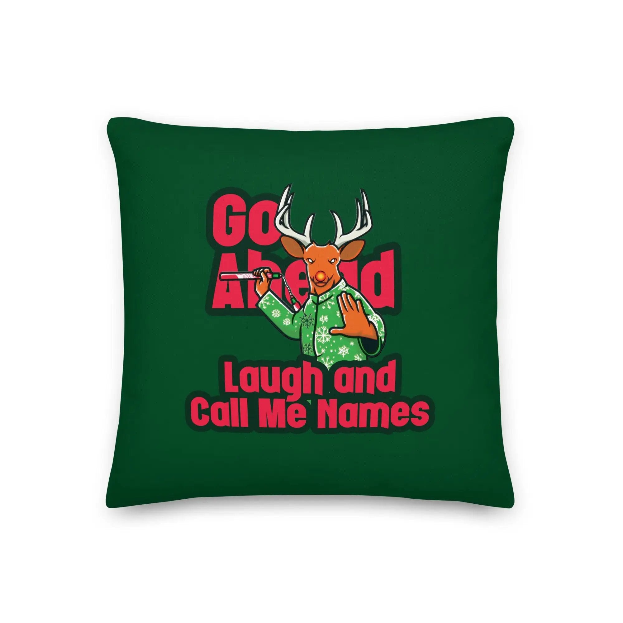 a green pillow with a deer on it