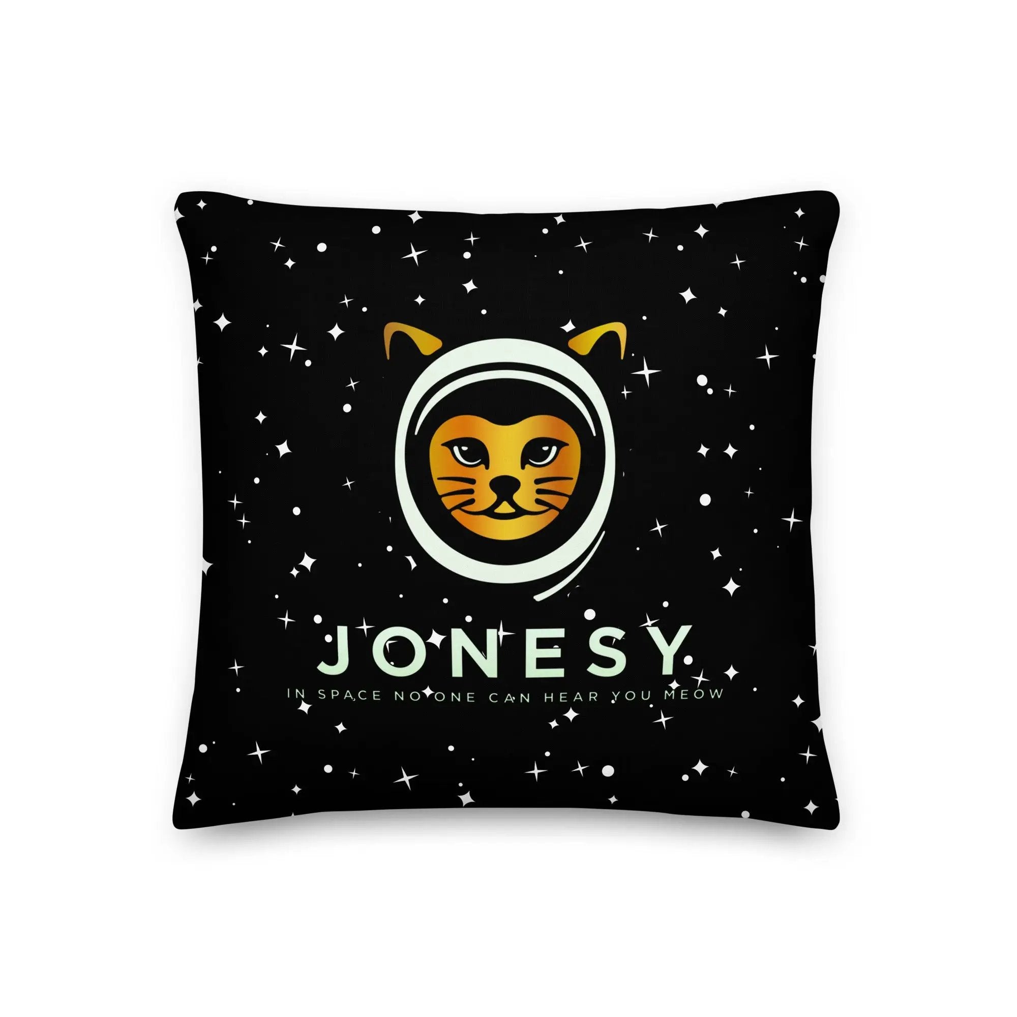 a black pillow with a yellow and white cat on it