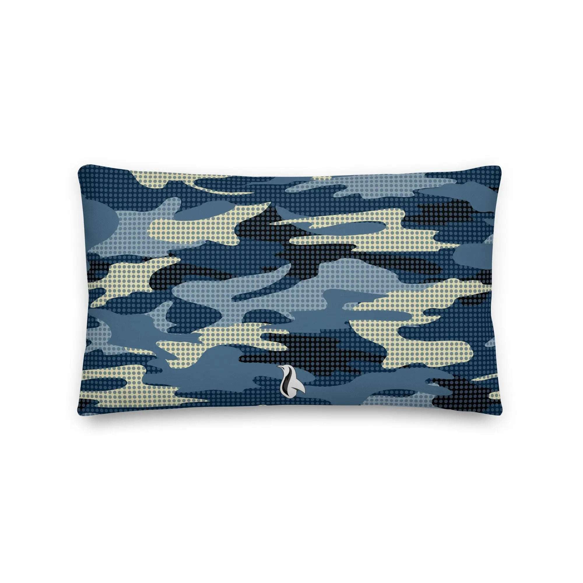 a blue camo pillow with a white sailboat on it