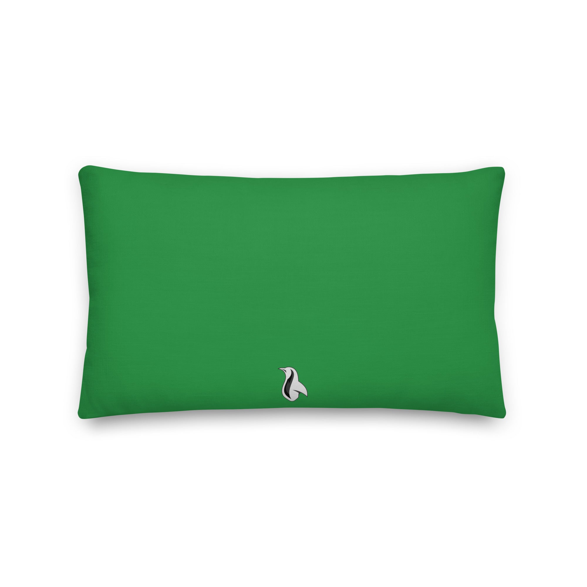 a green rectangular pillow with a black and white penguin on it