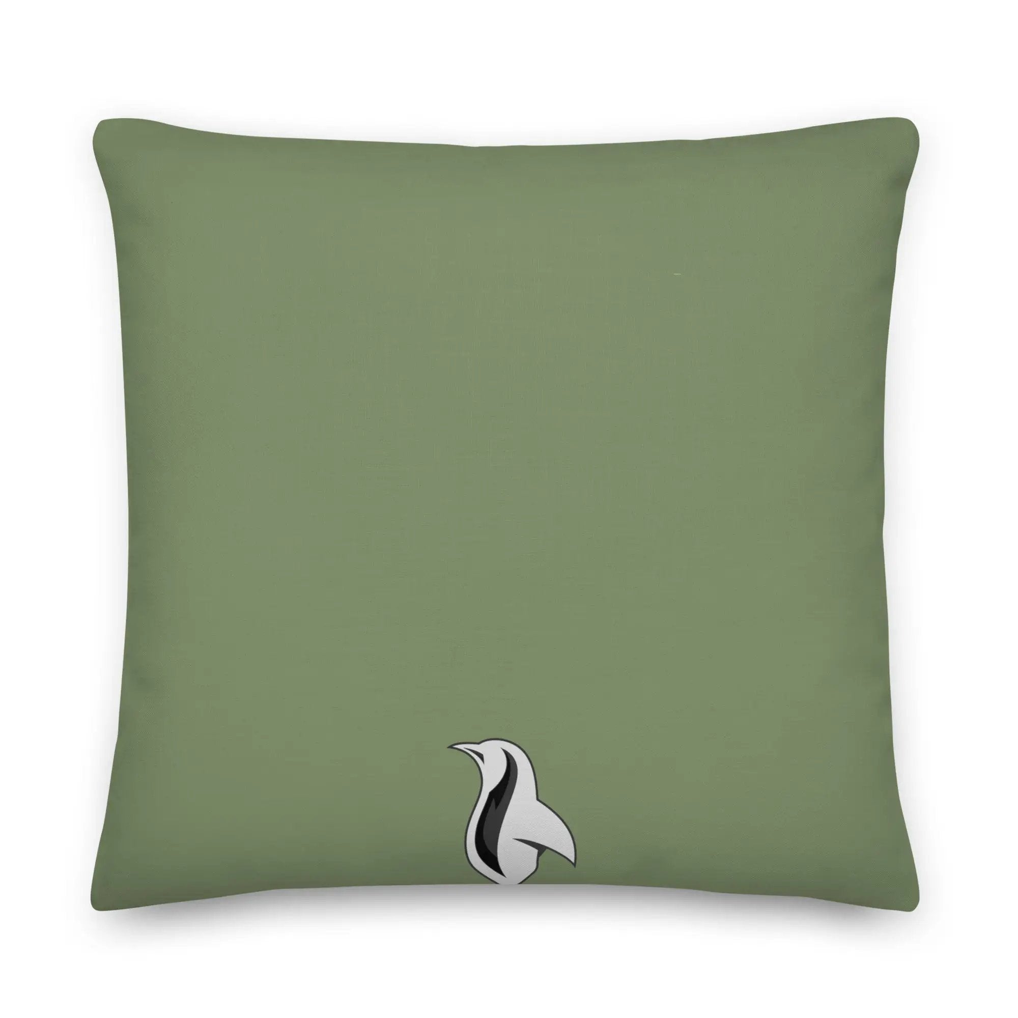 a green pillow with a black and white bird on it