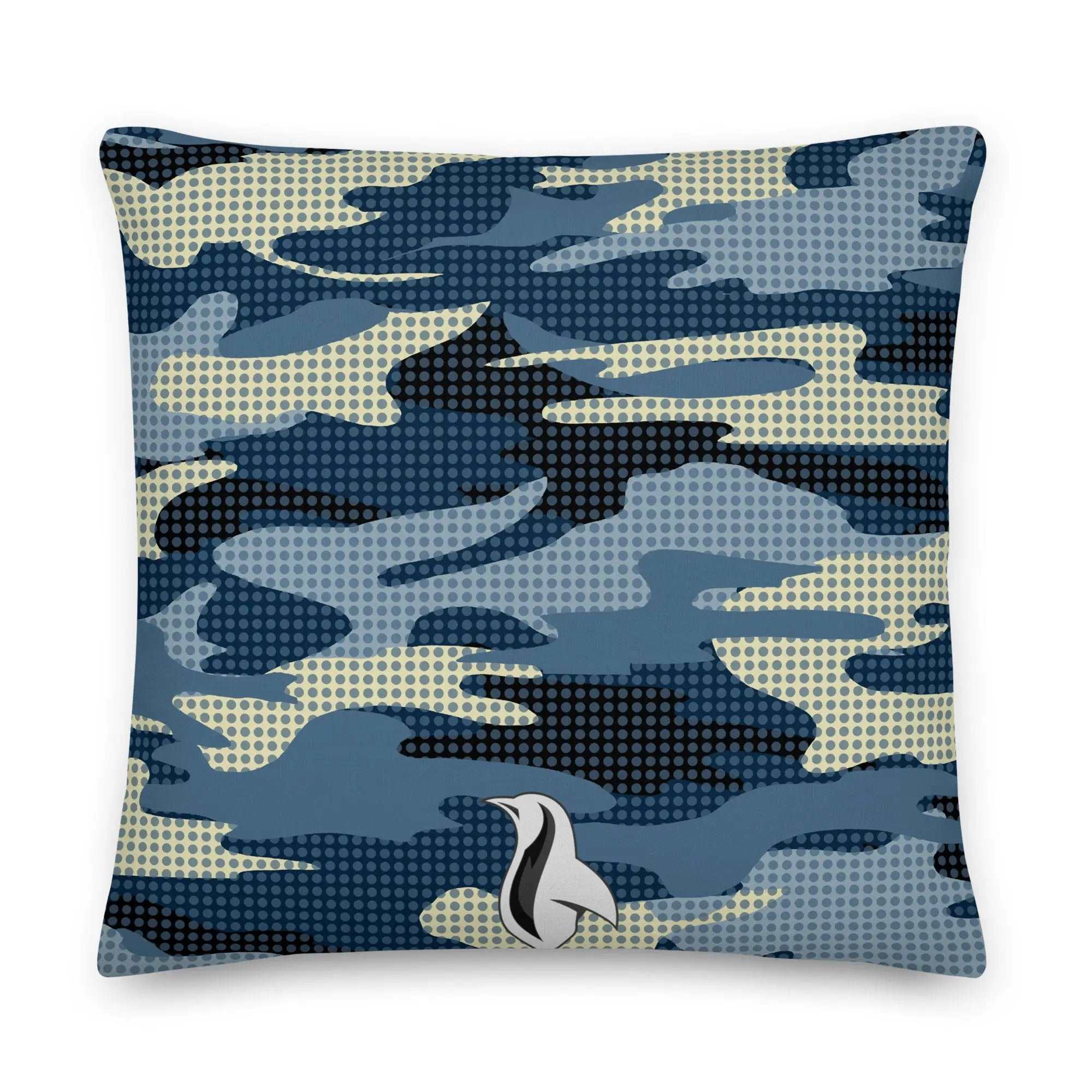 a blue and white pillow with a bird on it
