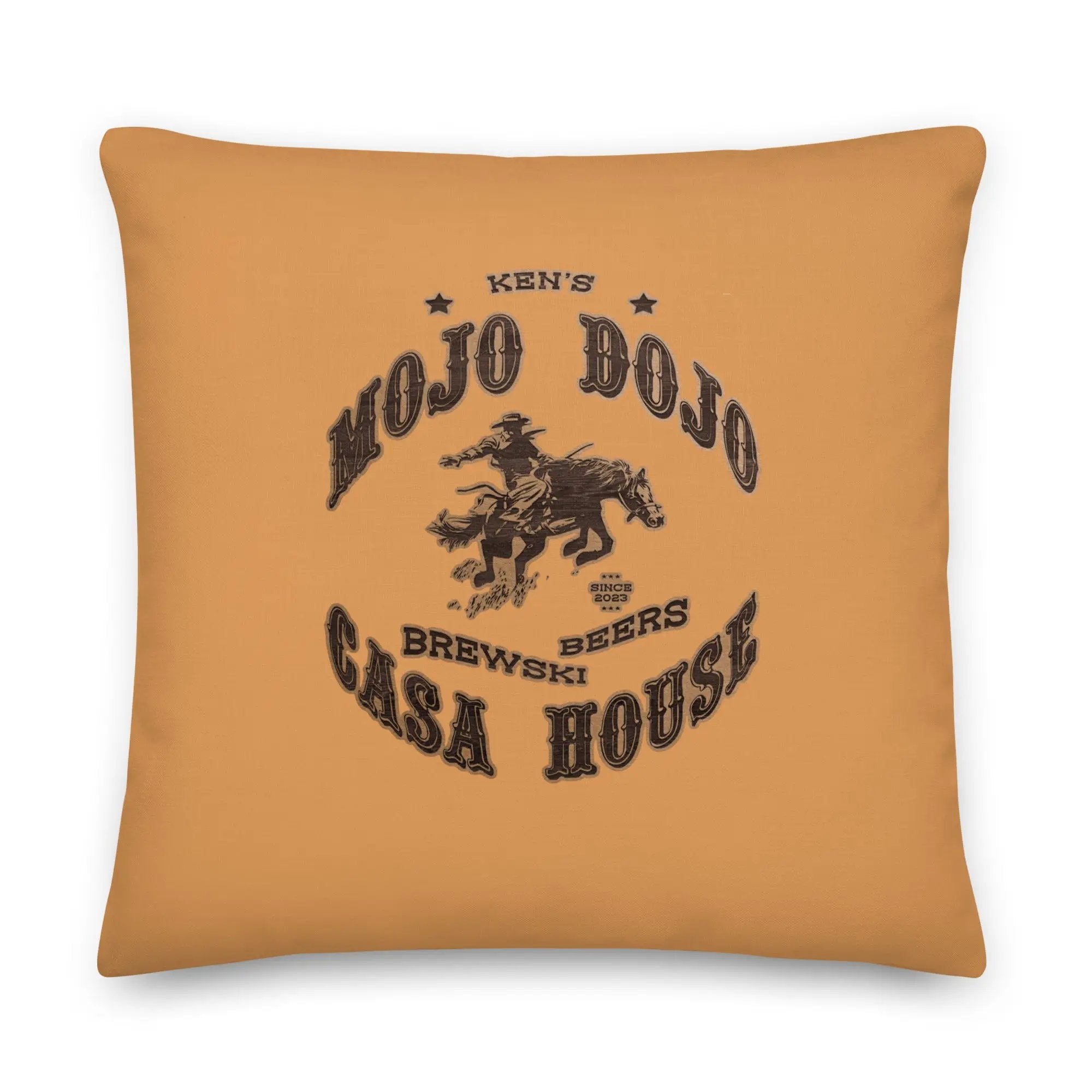 a yellow pillow with a cowboy on it