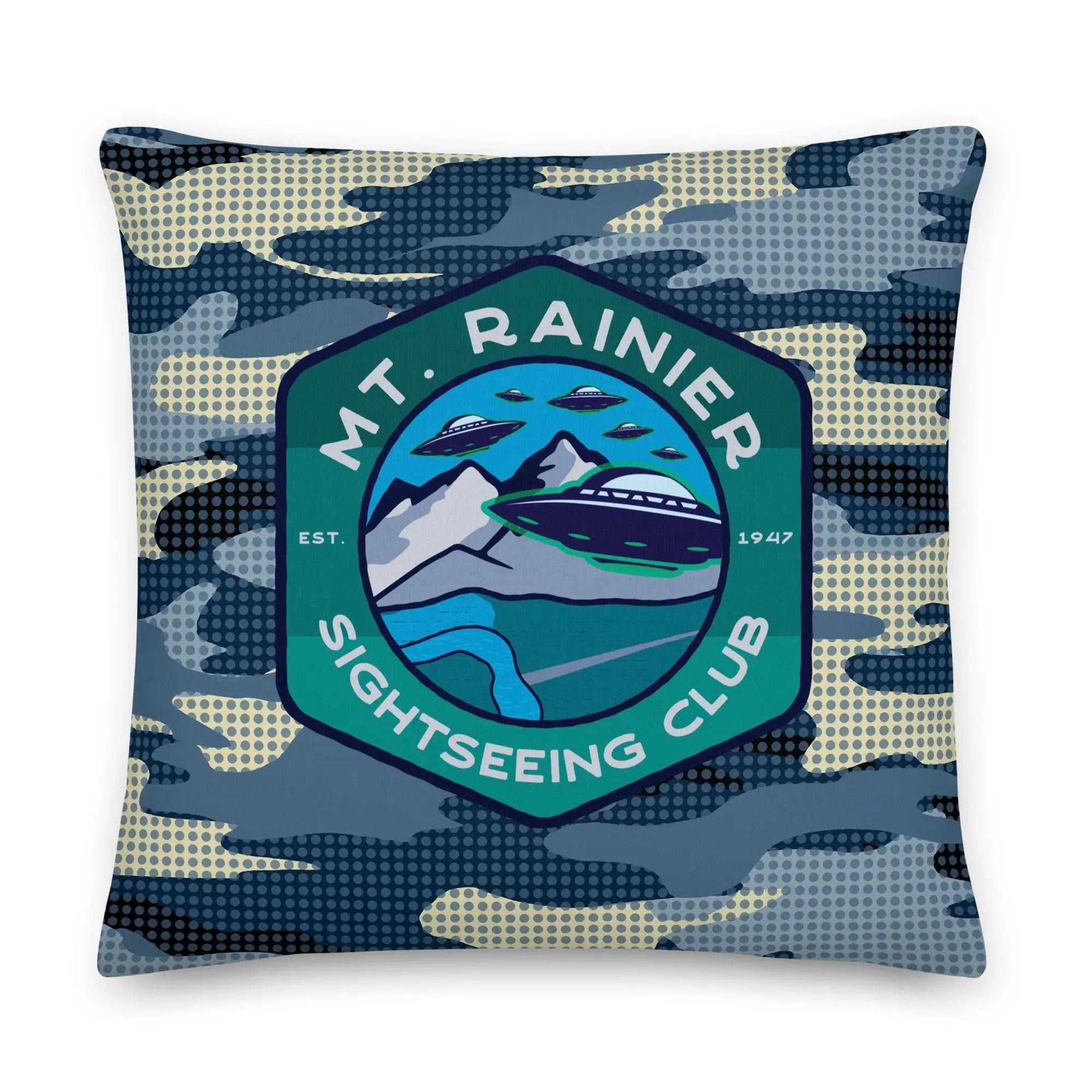 a blue camo pillow with the mt rainier logo on it