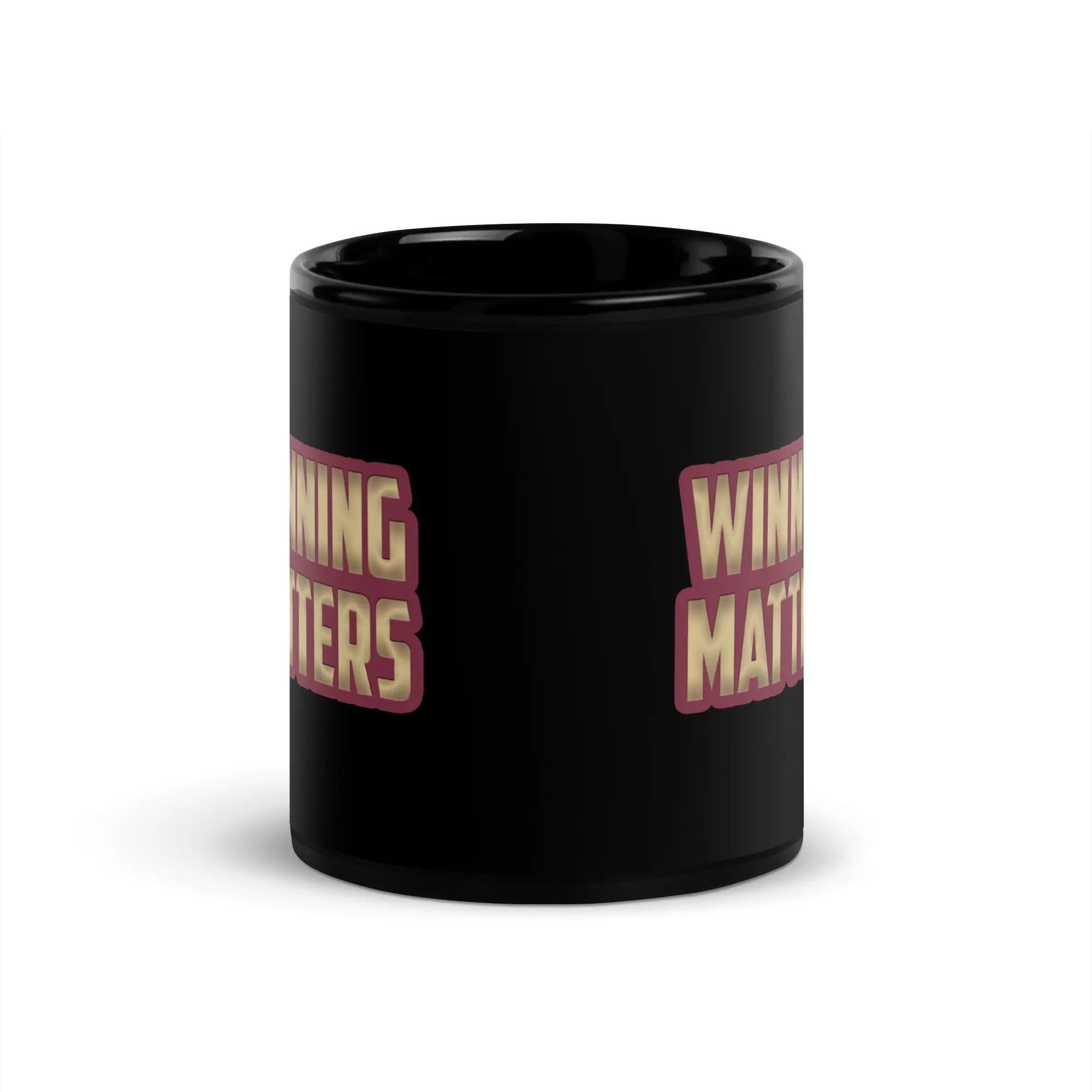 a black coffee mug with the words winning matters on it