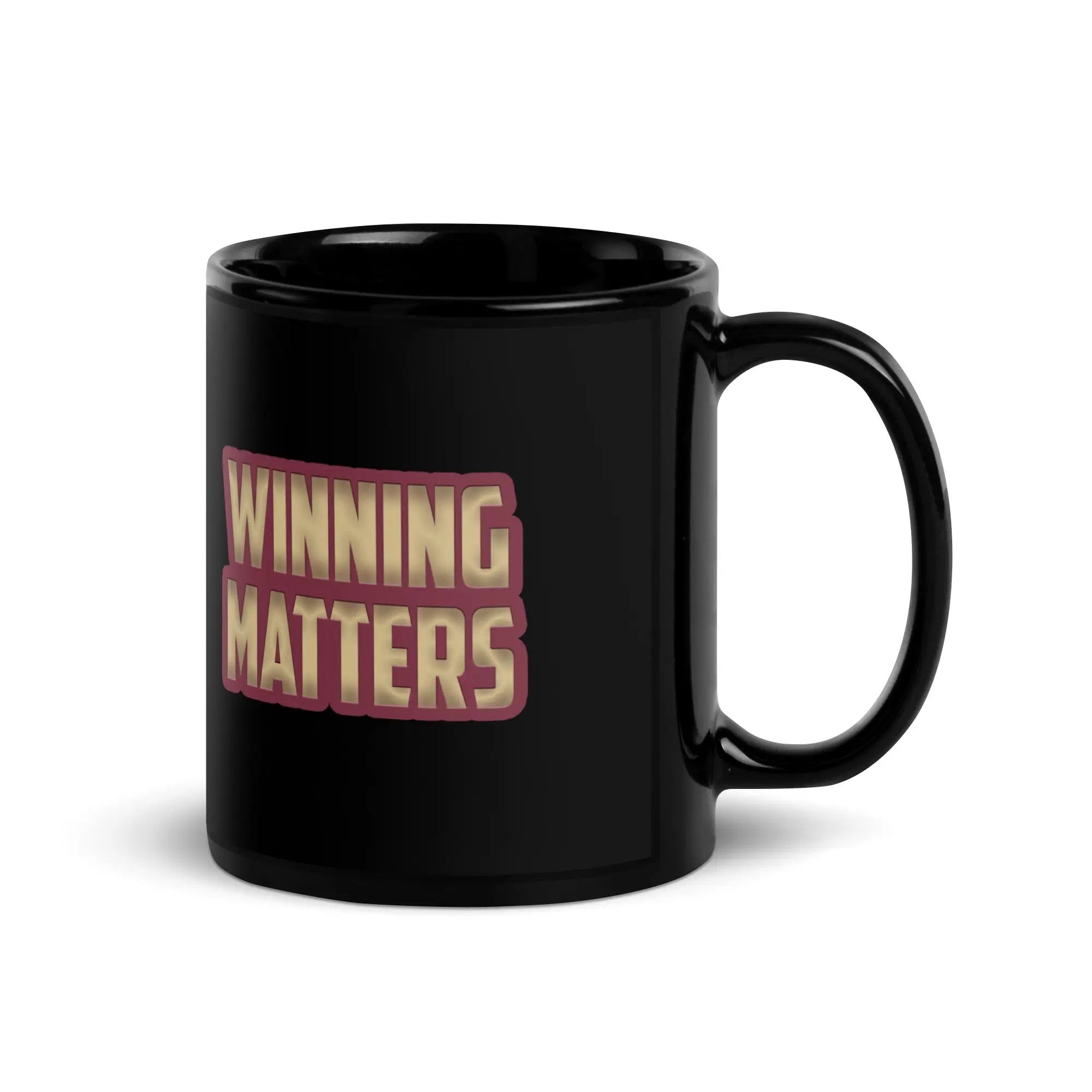a black coffee mug with the words winning matters on it