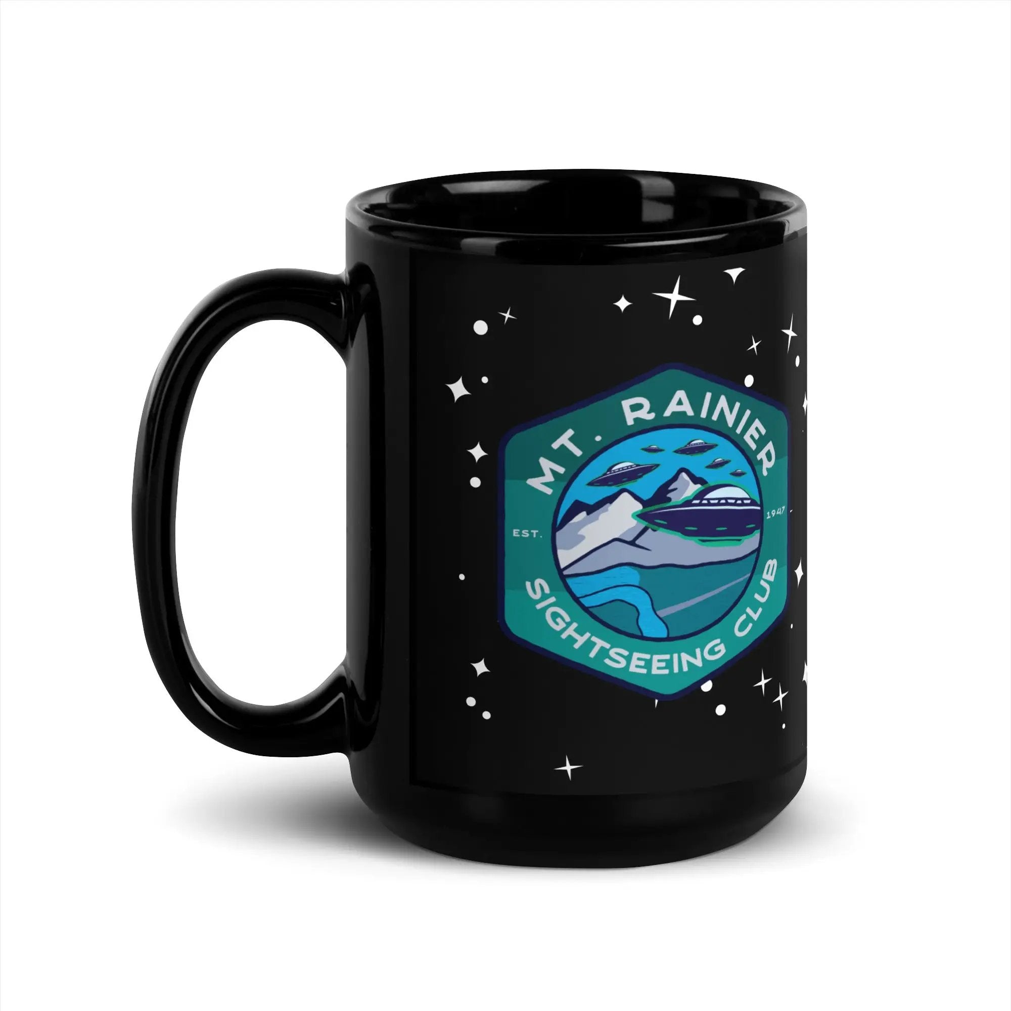 a black mug with the mt rainier logo on it