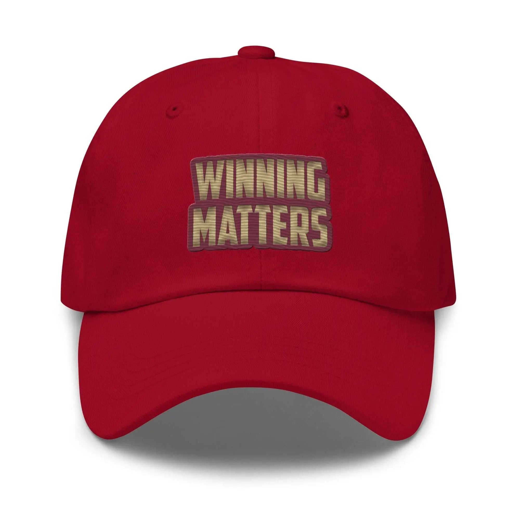 a red hat with the words winning matters printed on it