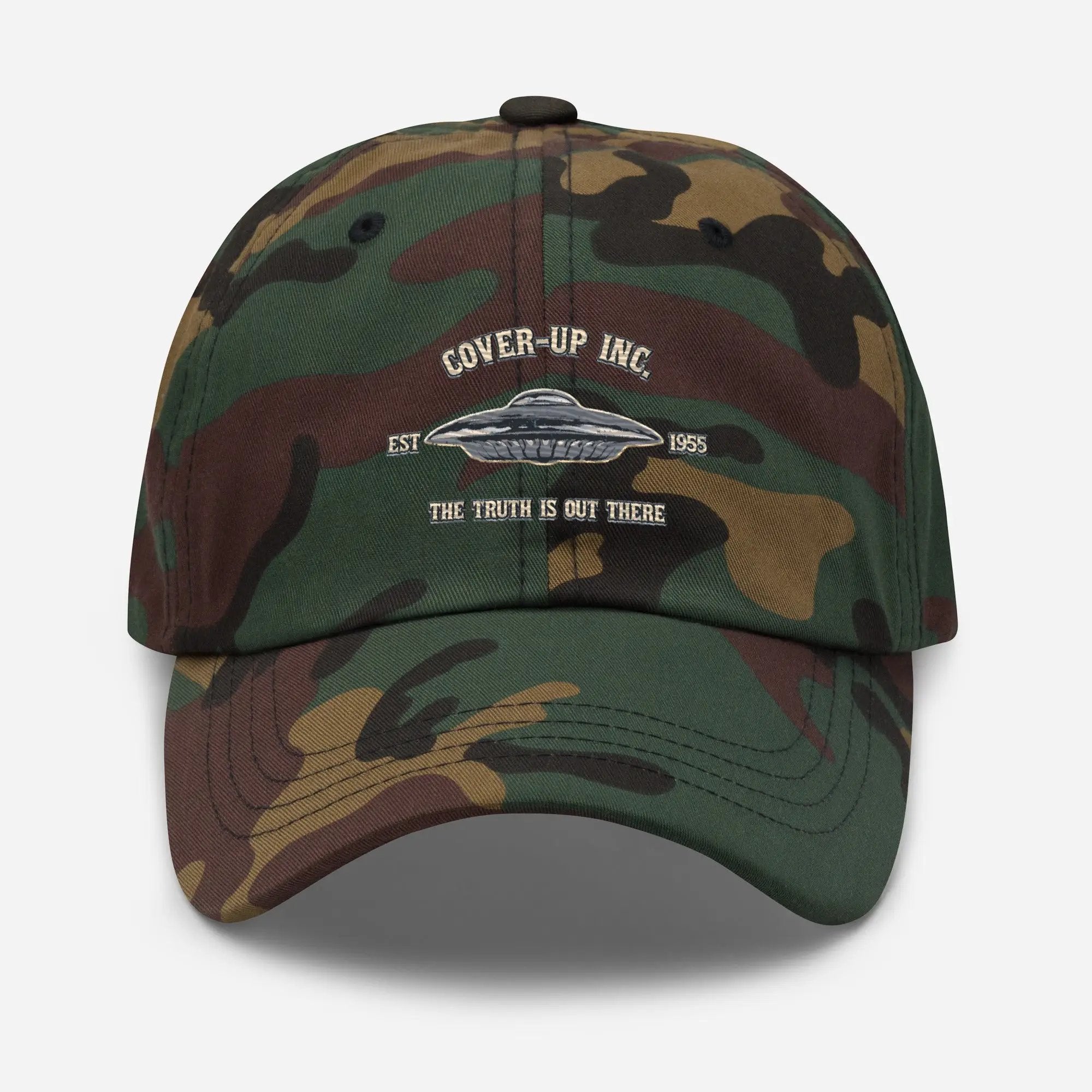 a camo hat with the words cover up inc on it
