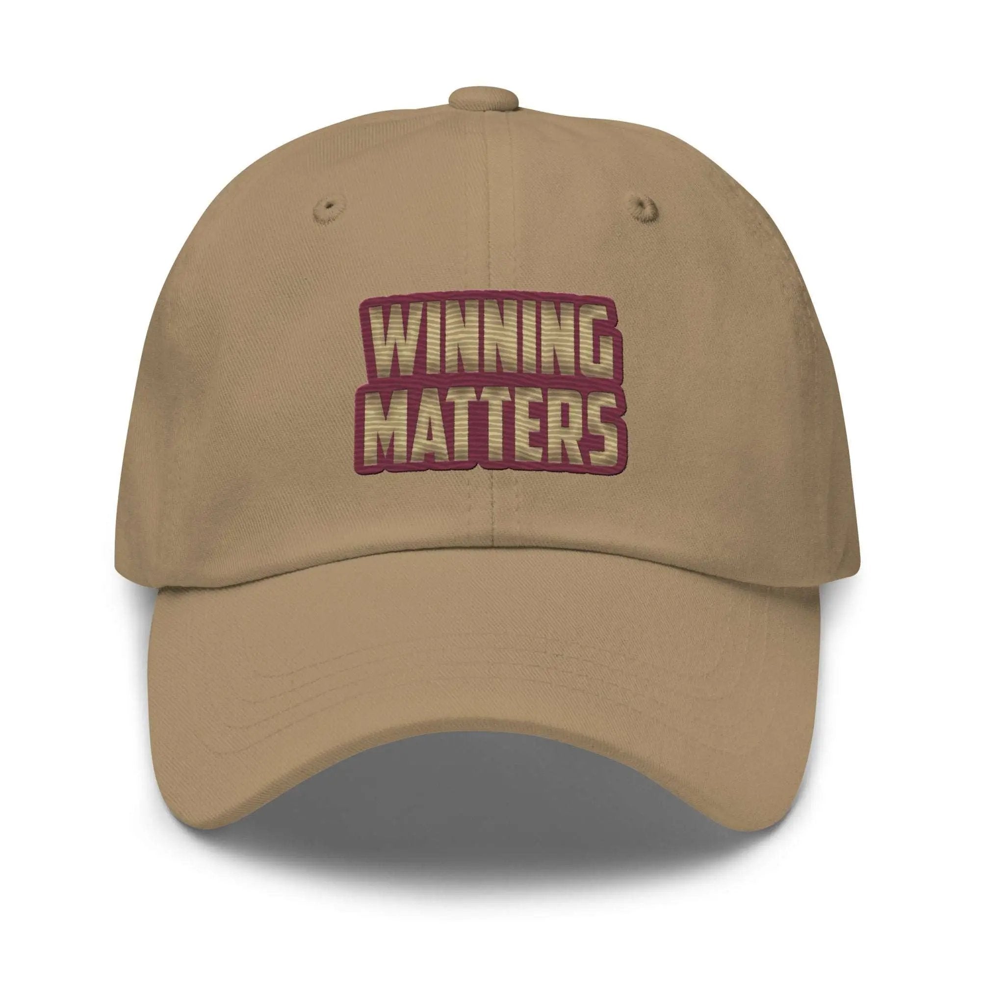 a tan hat with the words winning matters printed on it