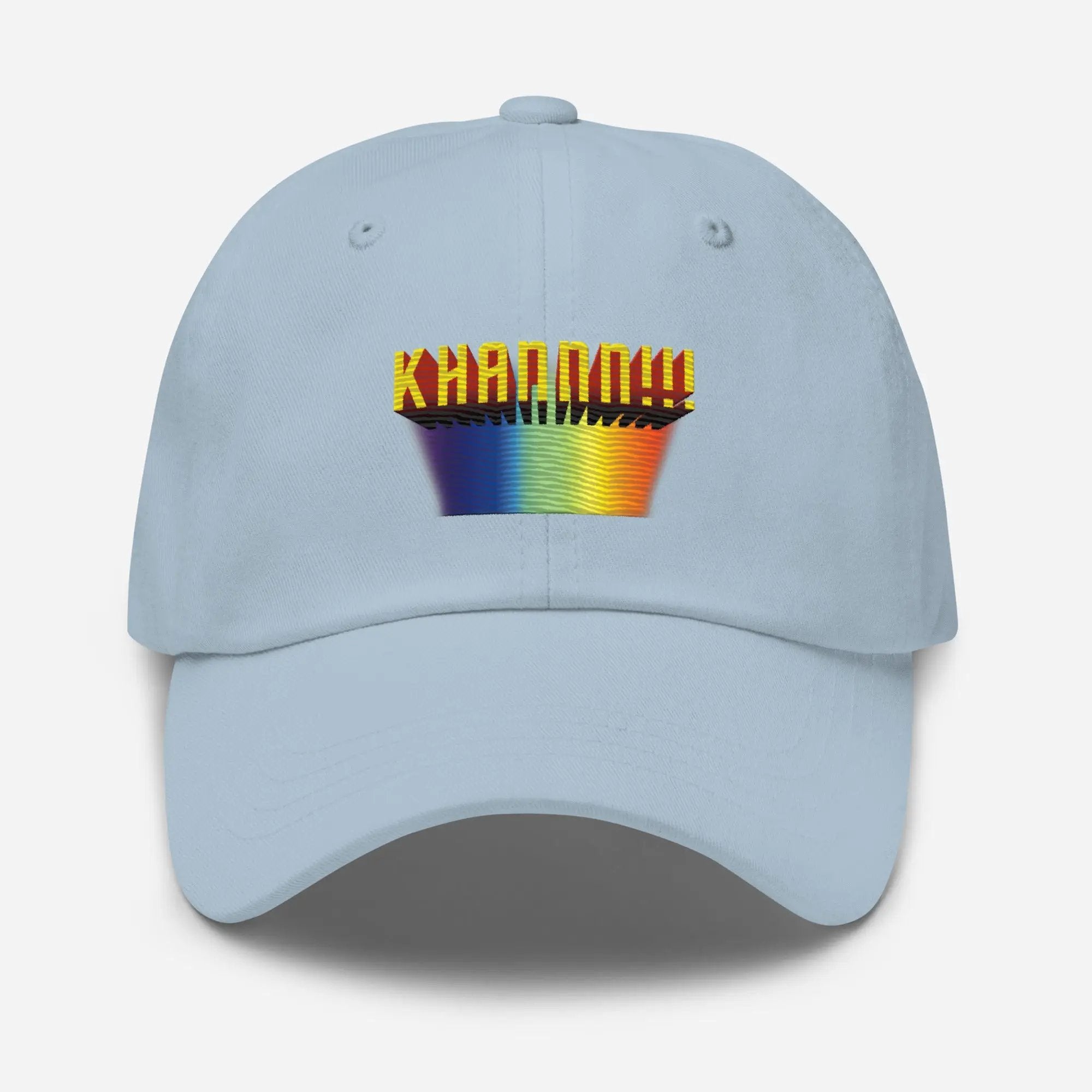 a light blue hat with a rainbow logo on it