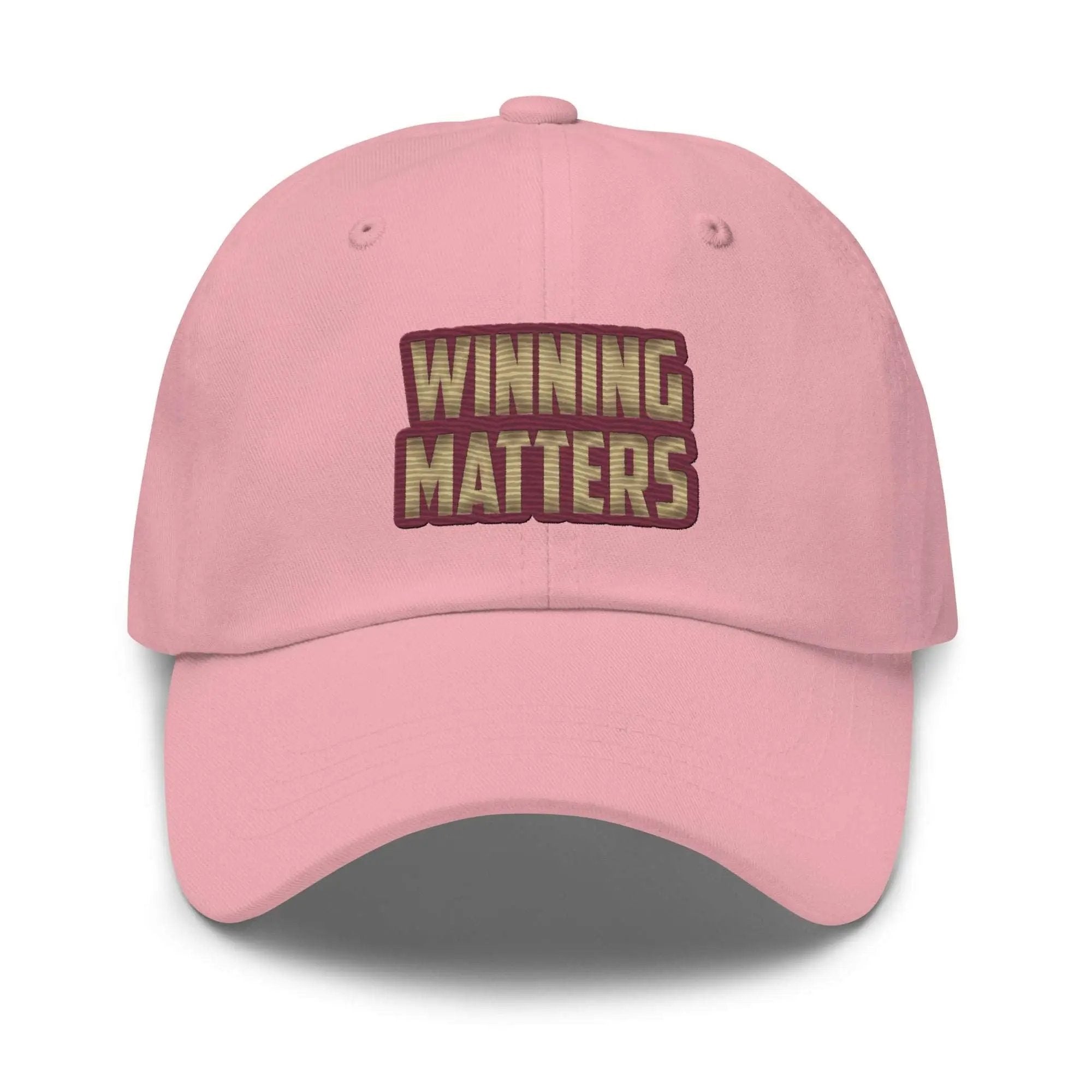 a pink hat with the words winning matters on it
