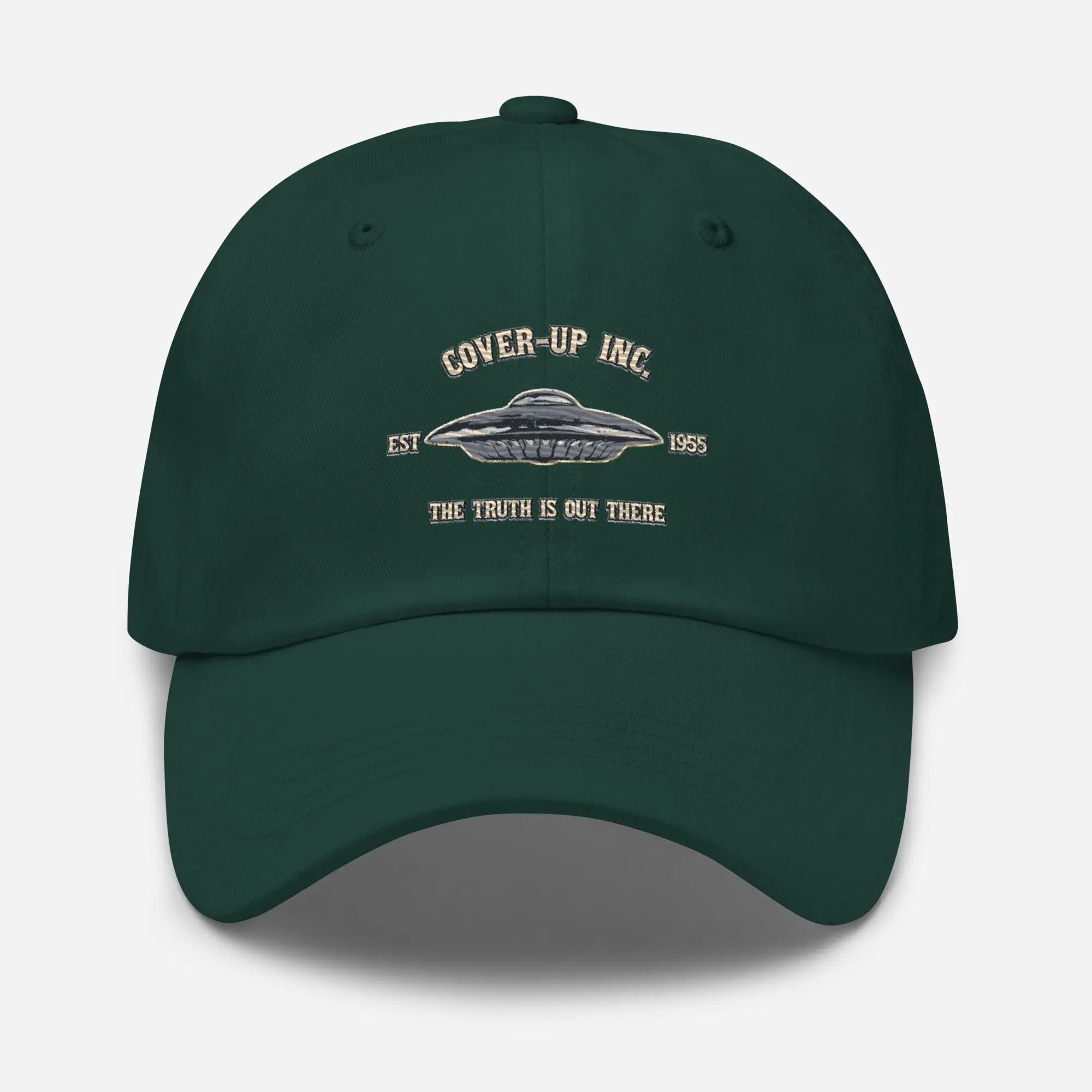 a green hat with the words cover up inc on it