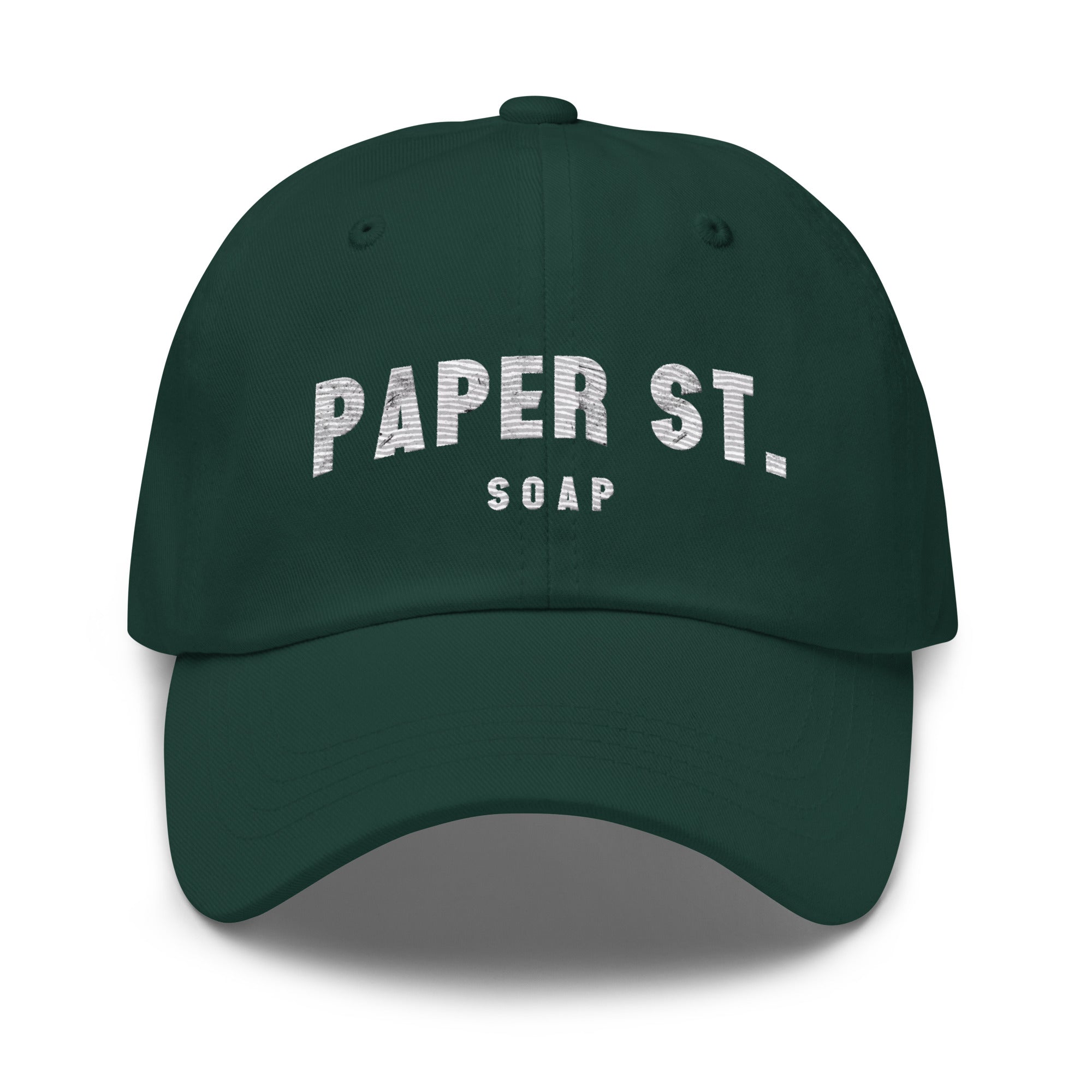 a green hat with a white paper st logo on it