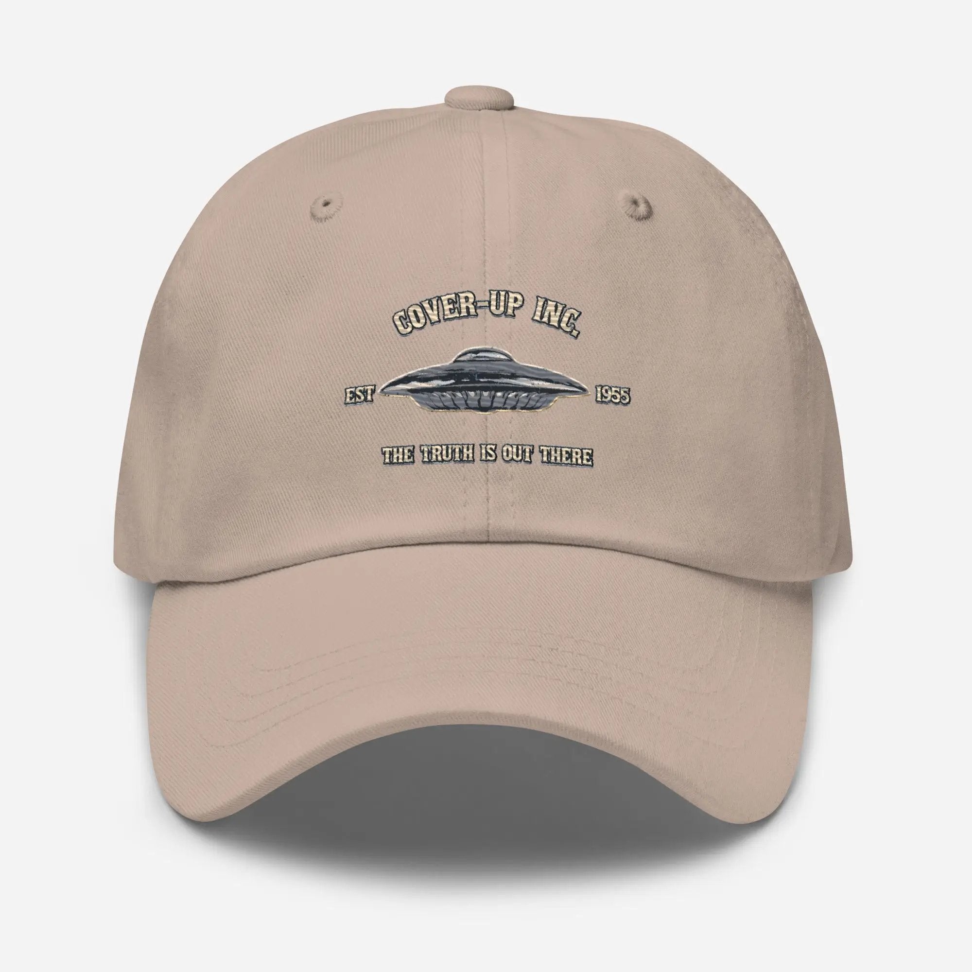 a beige hat with a flying saucer on it