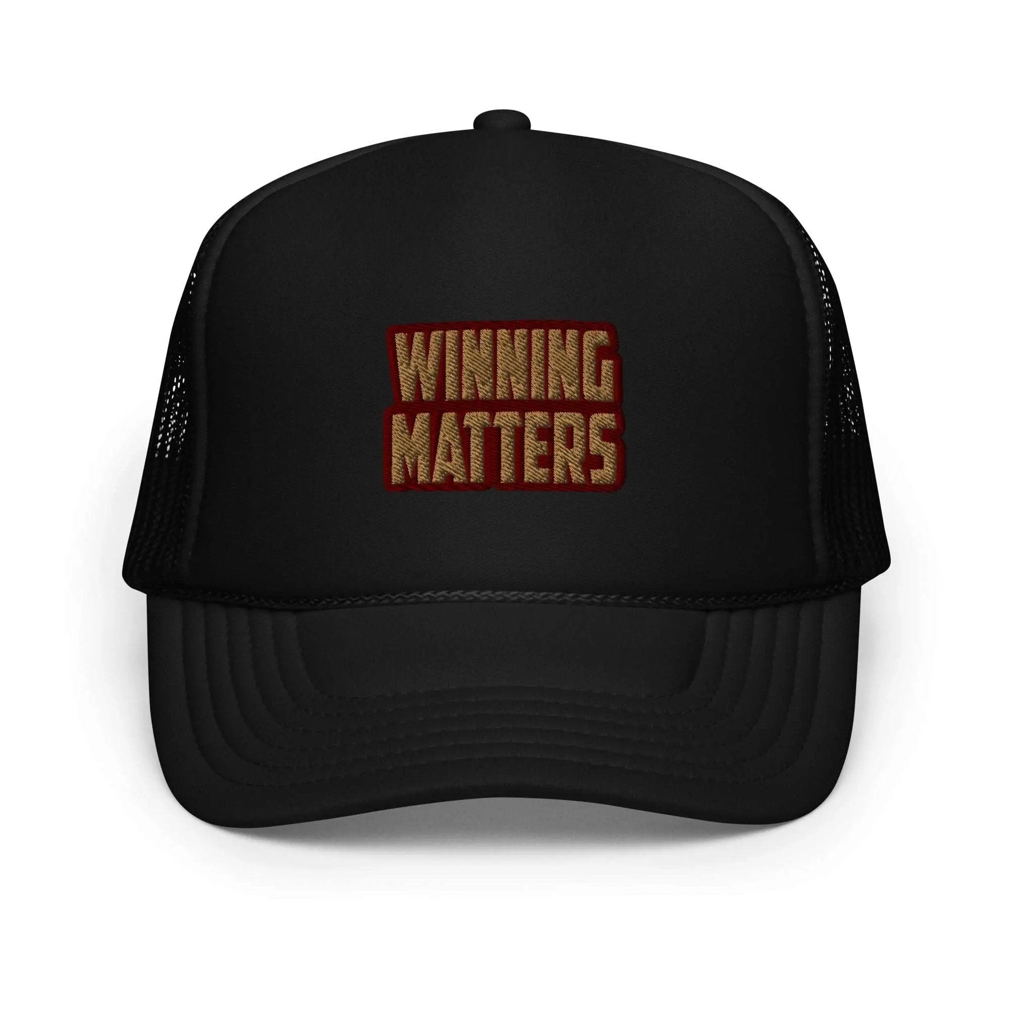 a black trucker hat with the words winning matters printed on it