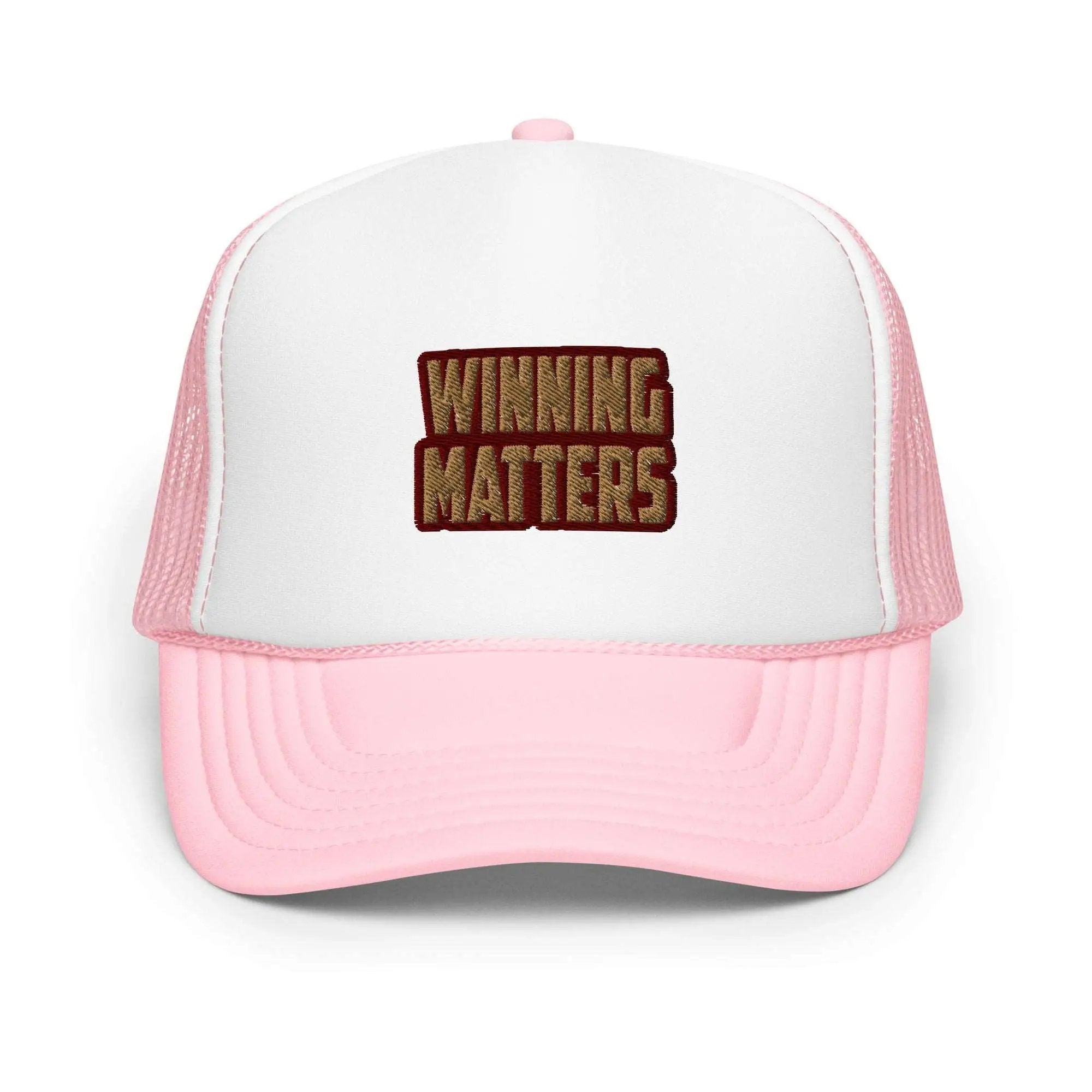 a pink and white trucker hat with the words winning matters on it