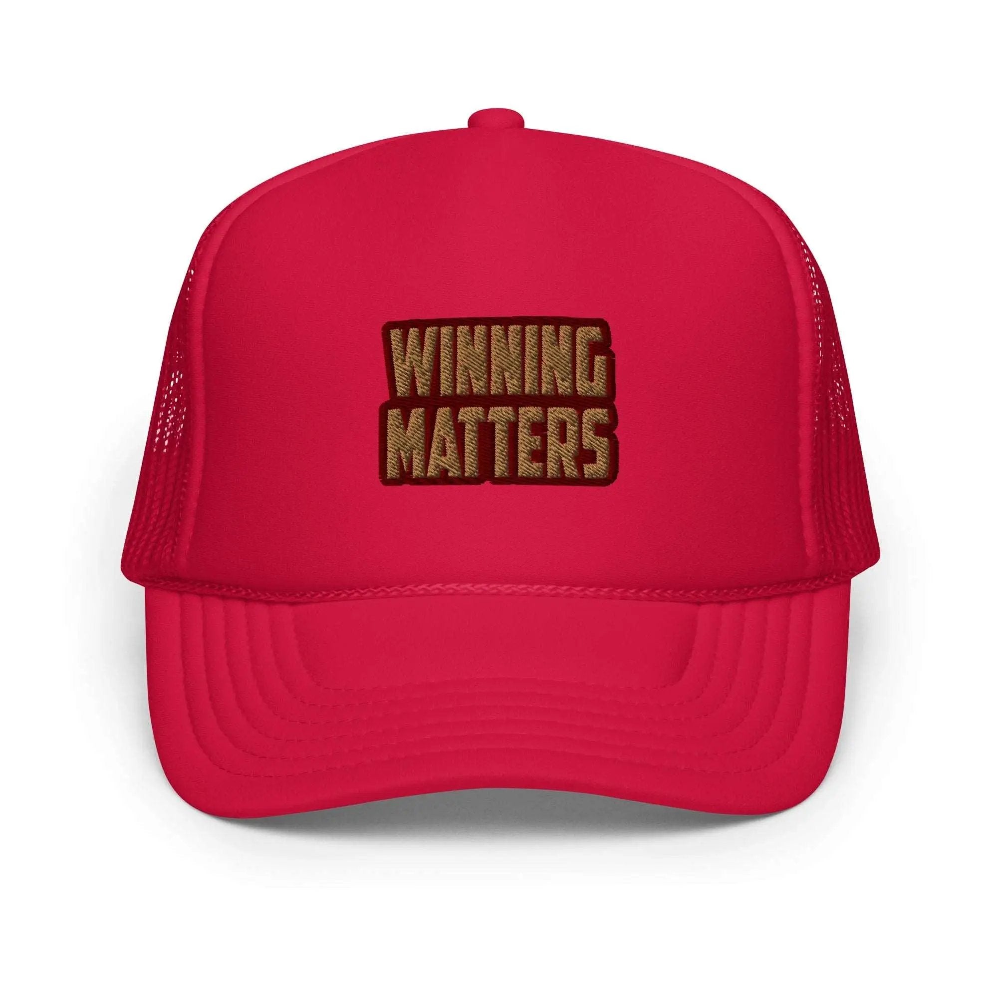 a red trucker hat with the words winning matters printed on it