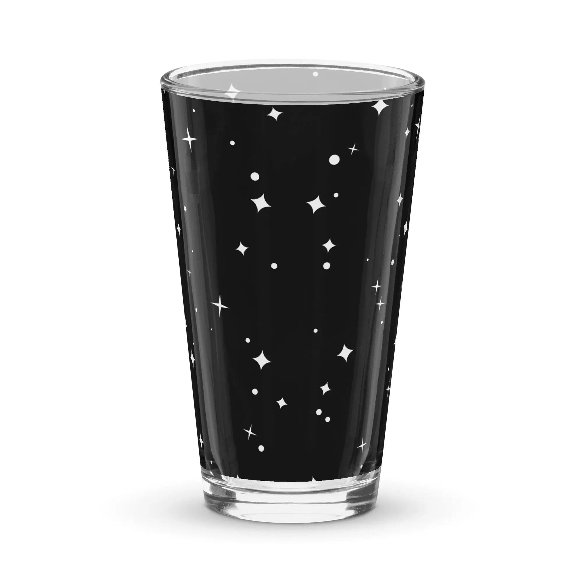 a black and white shot glass with stars on it