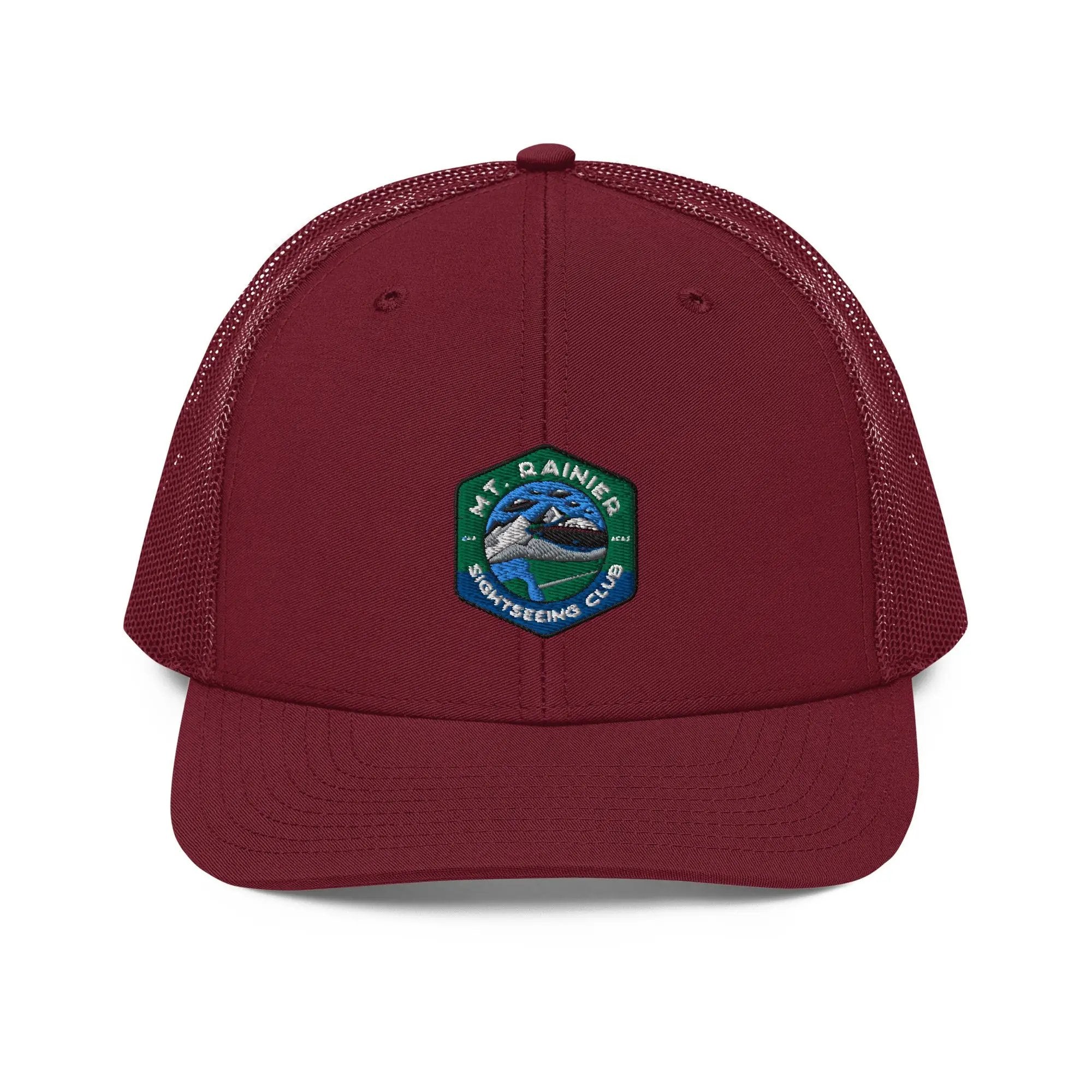 a maroon trucker hat with a patch on the front of it