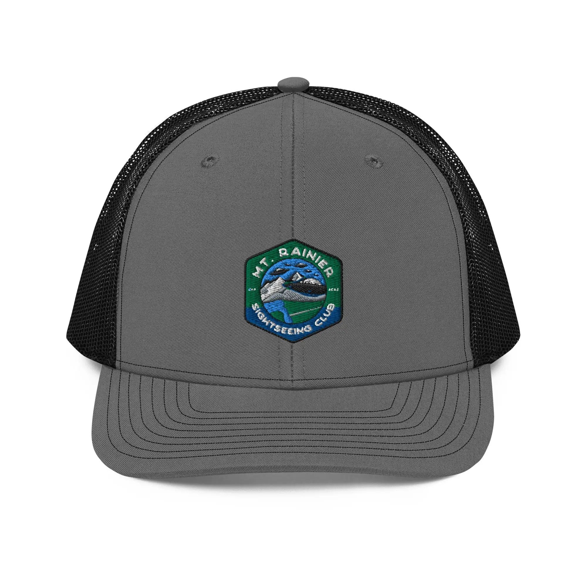 a gray and black trucker hat with a patch on the front