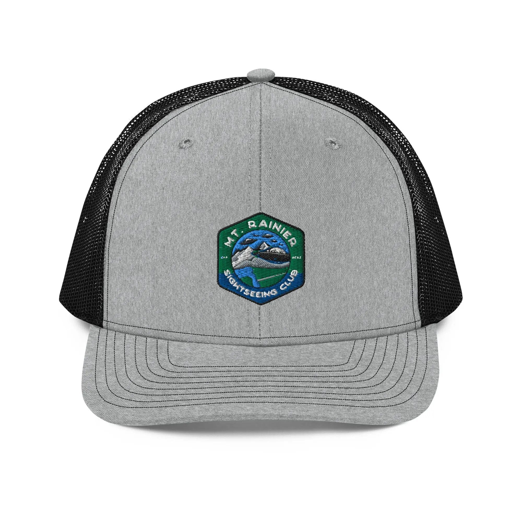 a gray and black trucker hat with a patch on the front