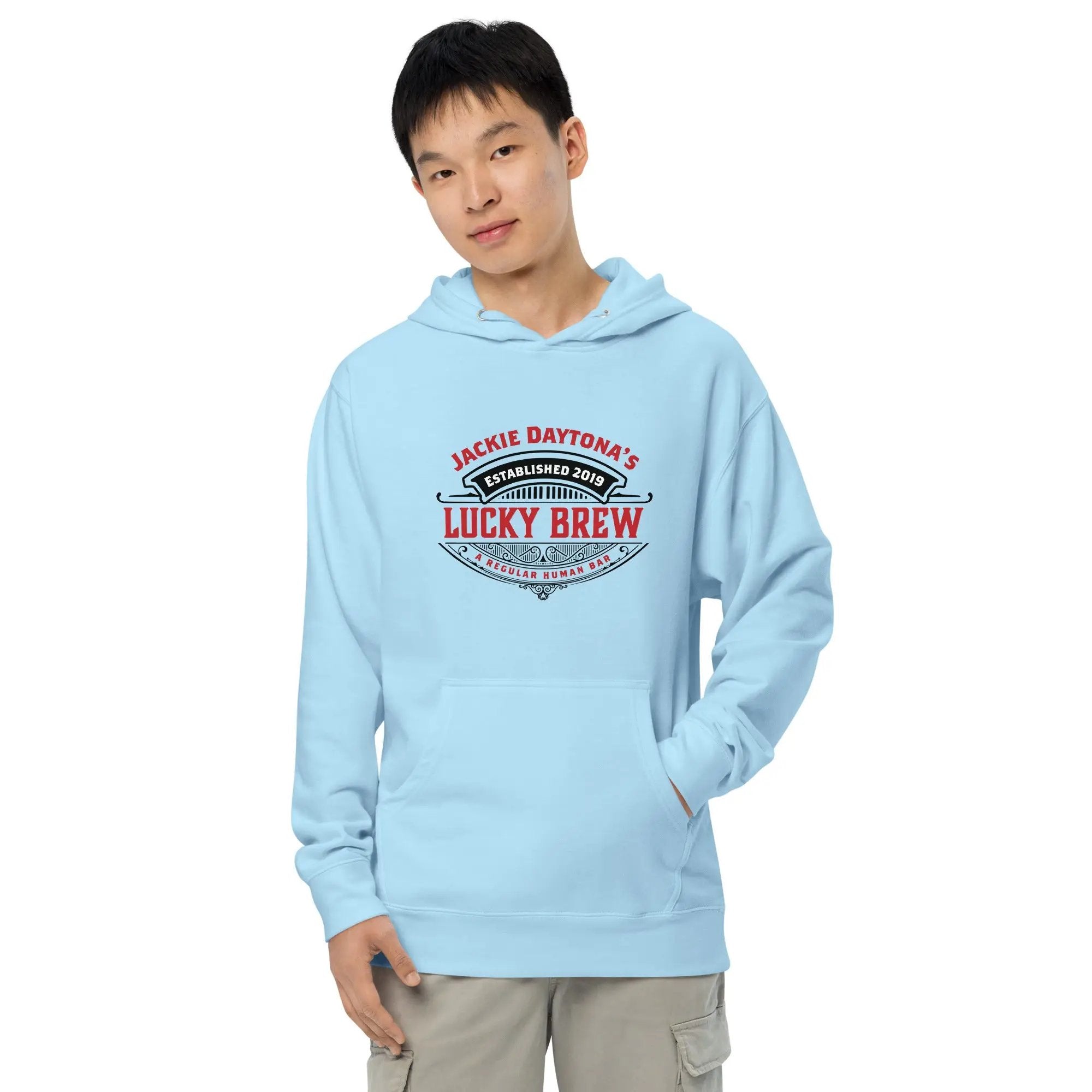 a young man wearing a light blue hoodie