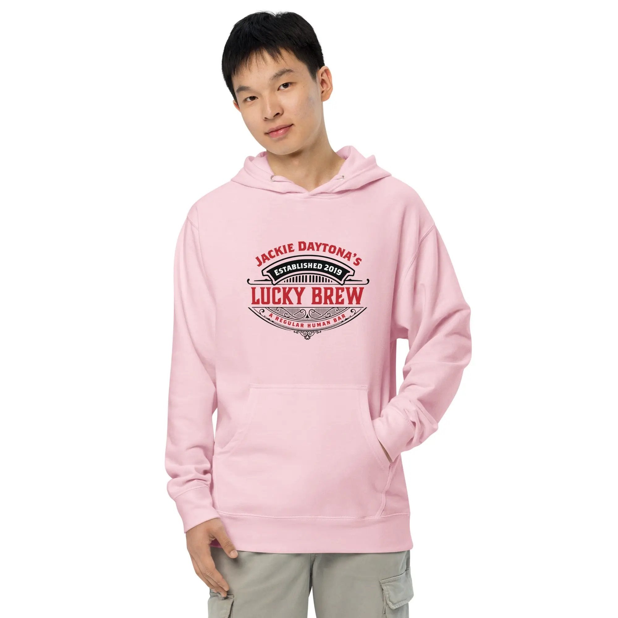 a man wearing a pink hoodie that says lucky brew