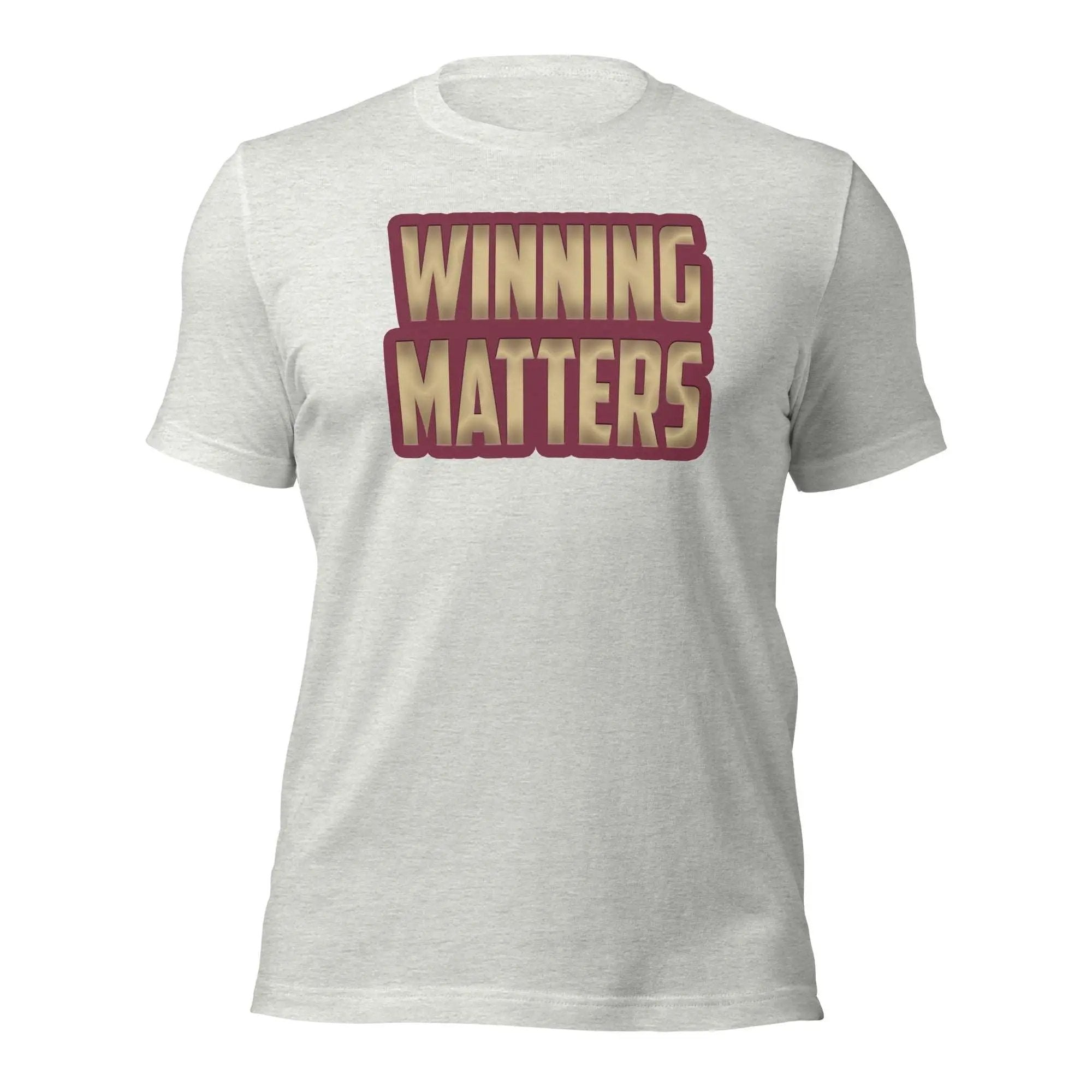 a white t - shirt with the words winning matters printed on it