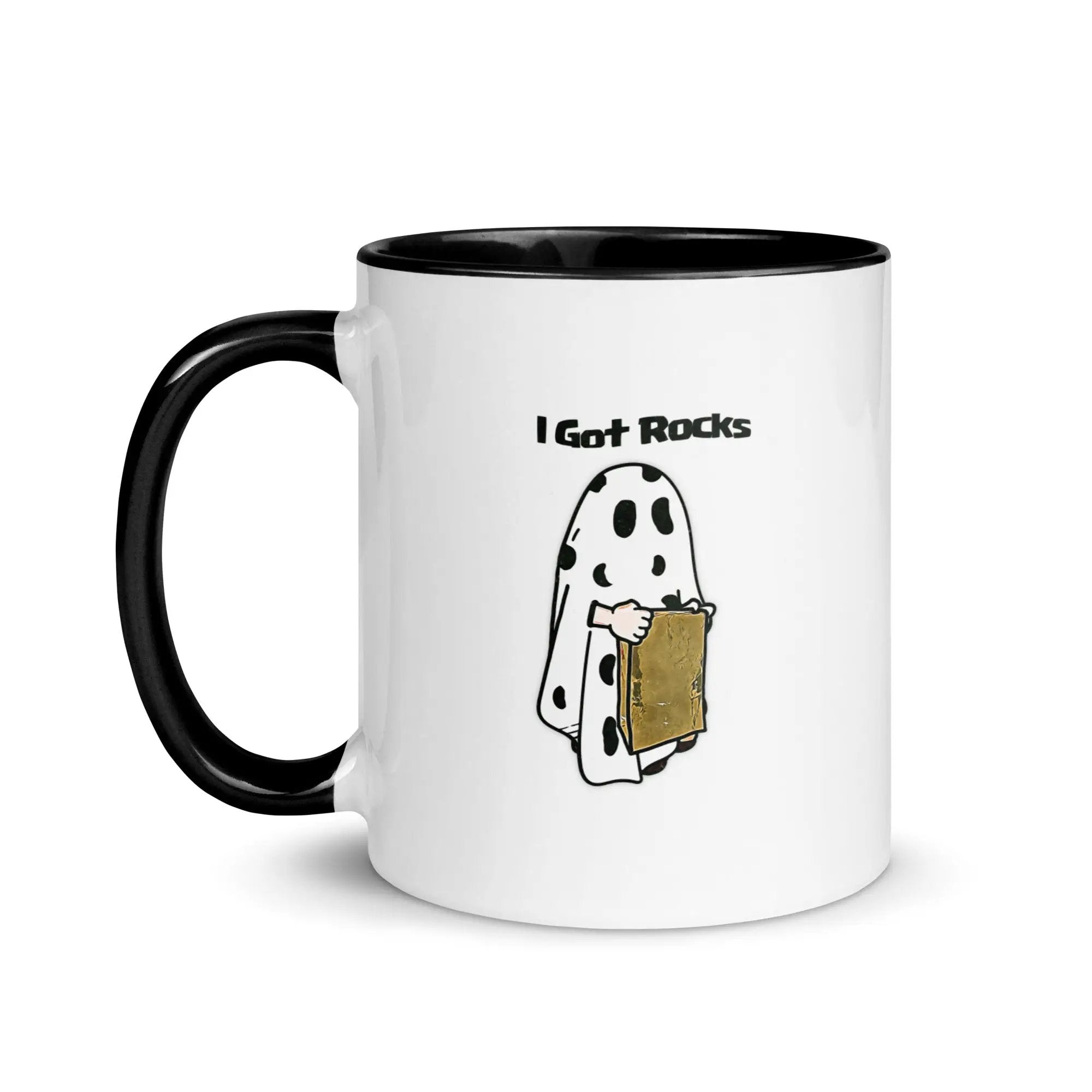 a black and white coffee mug with a cartoon of a ghost holding a piece of