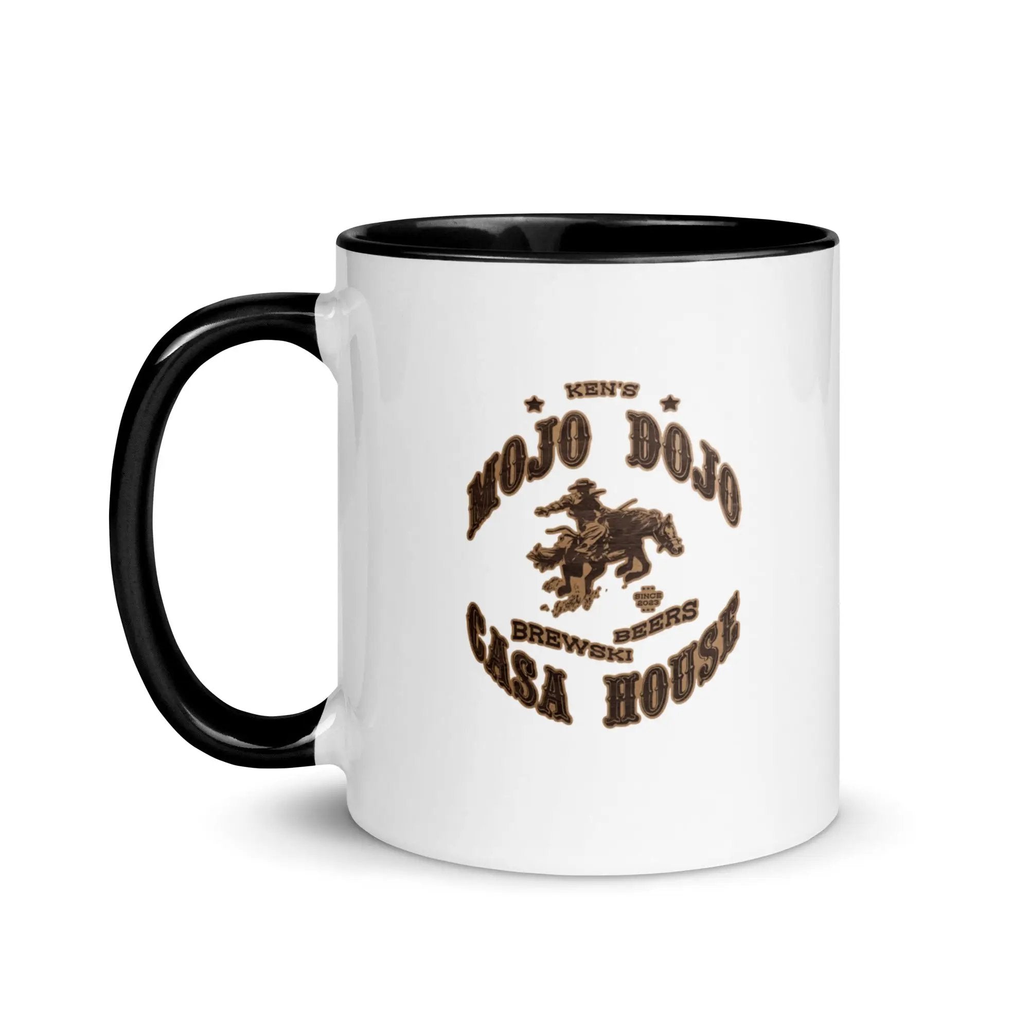 a white and black coffee mug with a brown logo