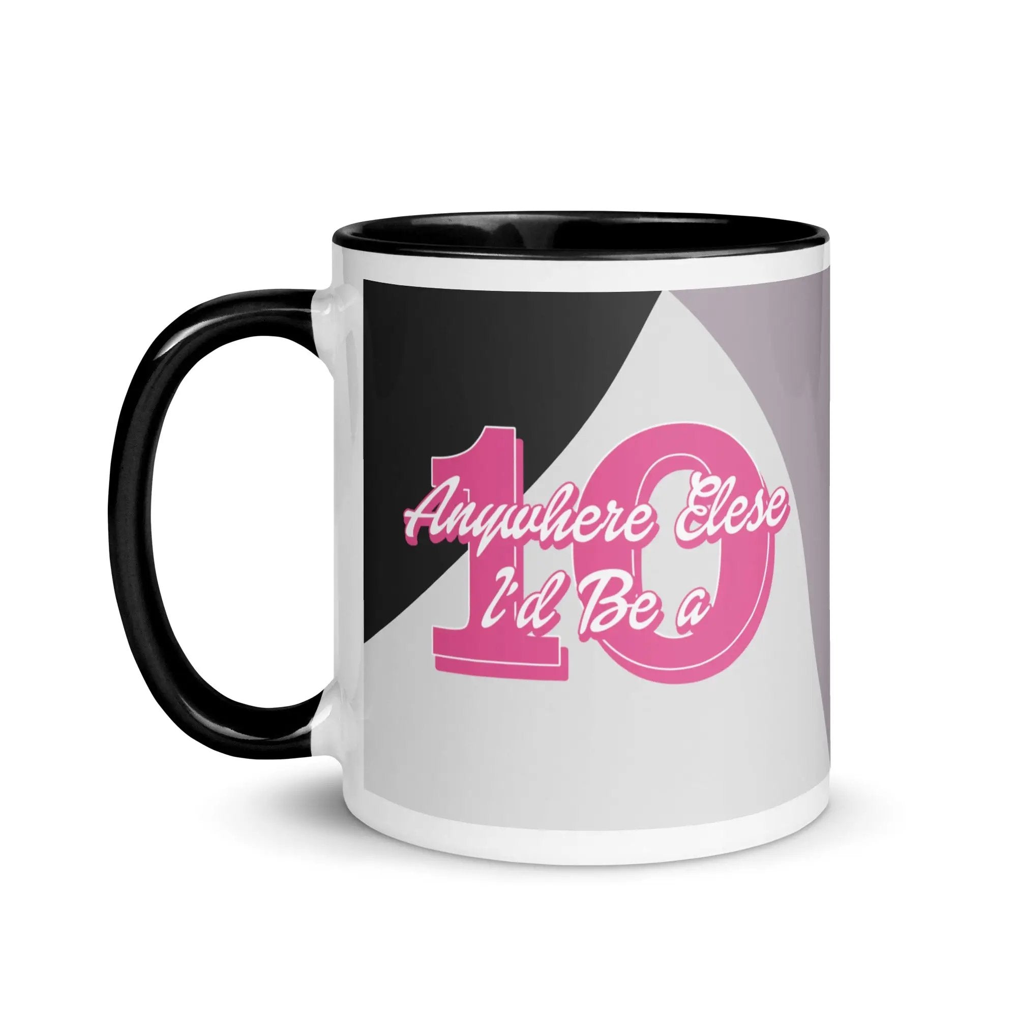 a black and white coffee mug with pink lettering