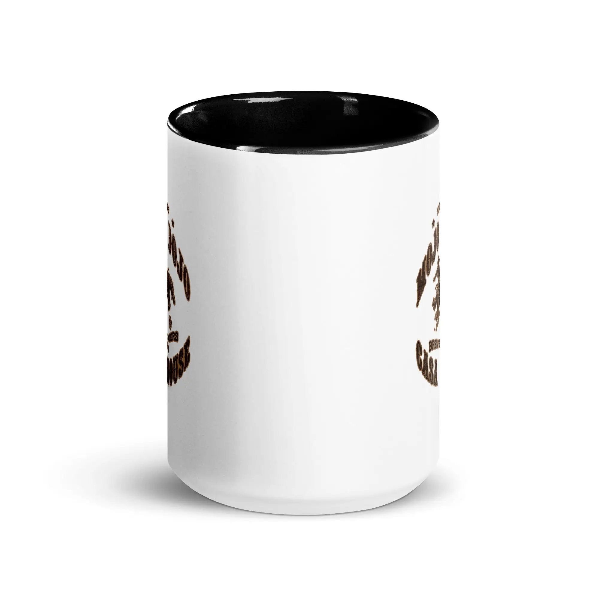 a white and black coffee mug with a smiley face on it