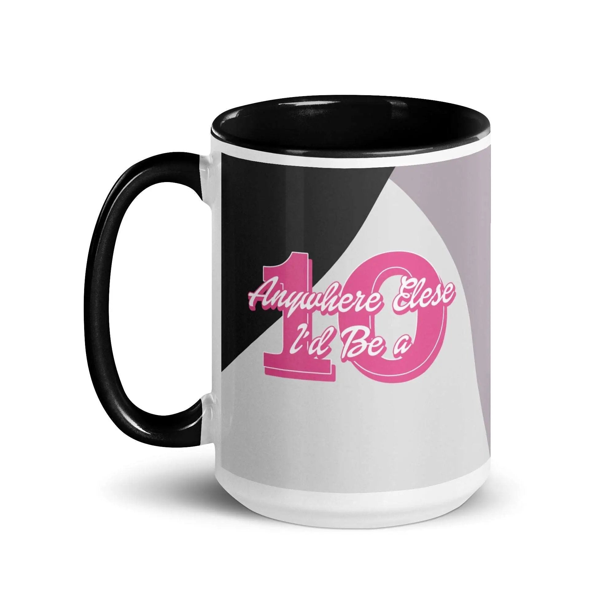 a black and white coffee mug with pink lettering