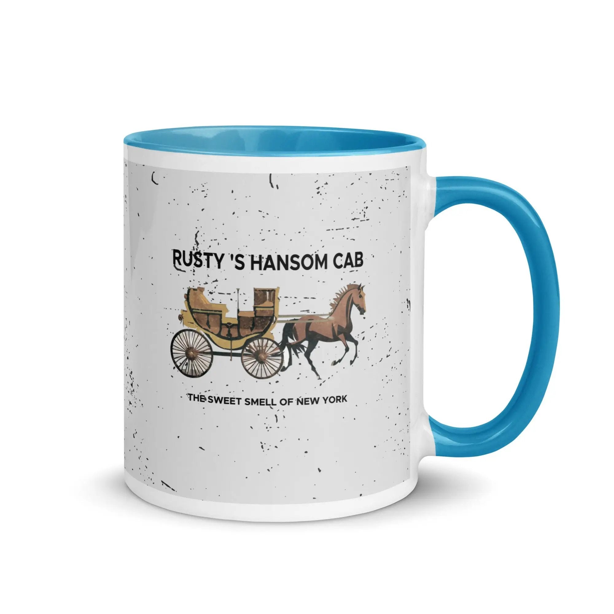 a blue and white coffee mug with a horse drawn carriage