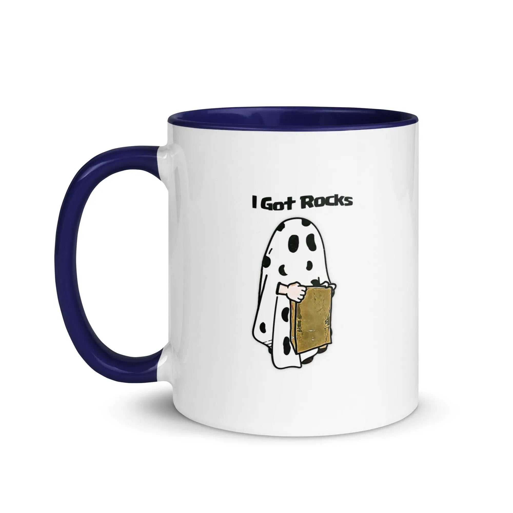 a white and blue coffee mug with a cartoon of a ghost holding a piece of