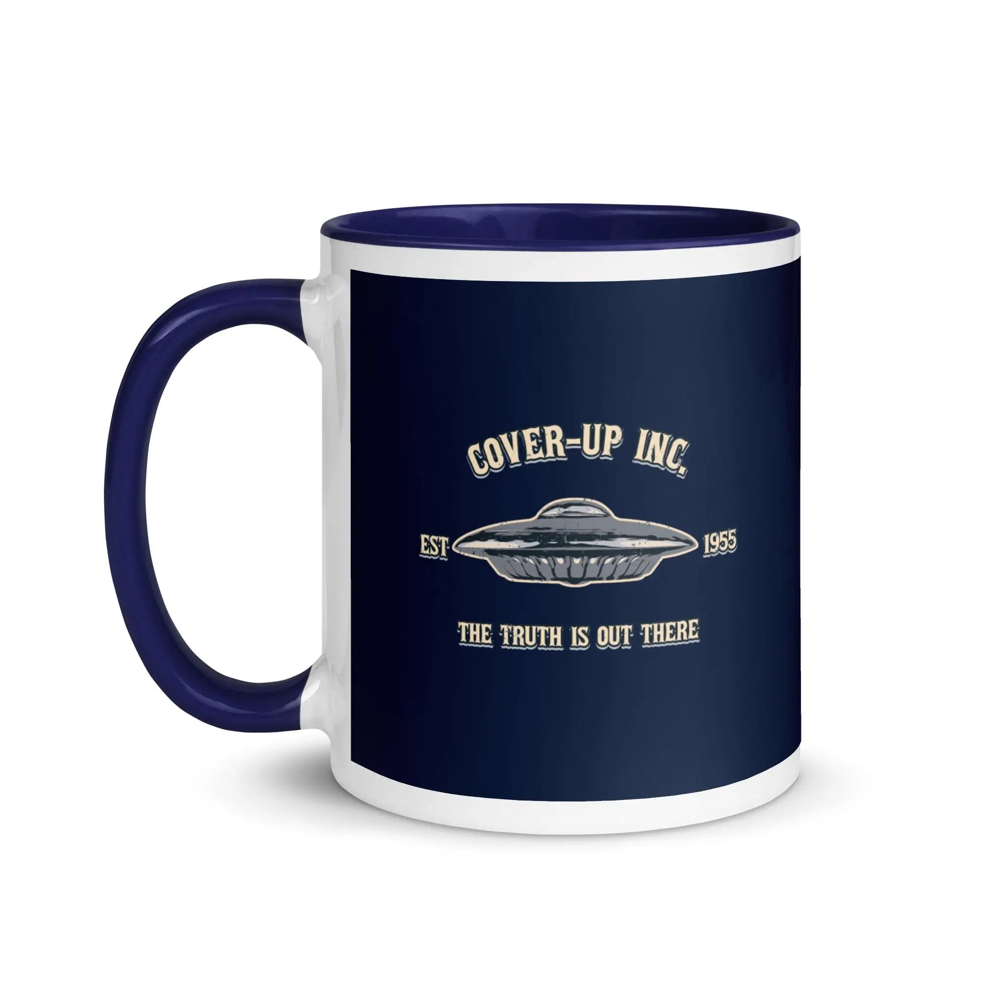 a blue and white coffee mug with the words cover - up inc on it