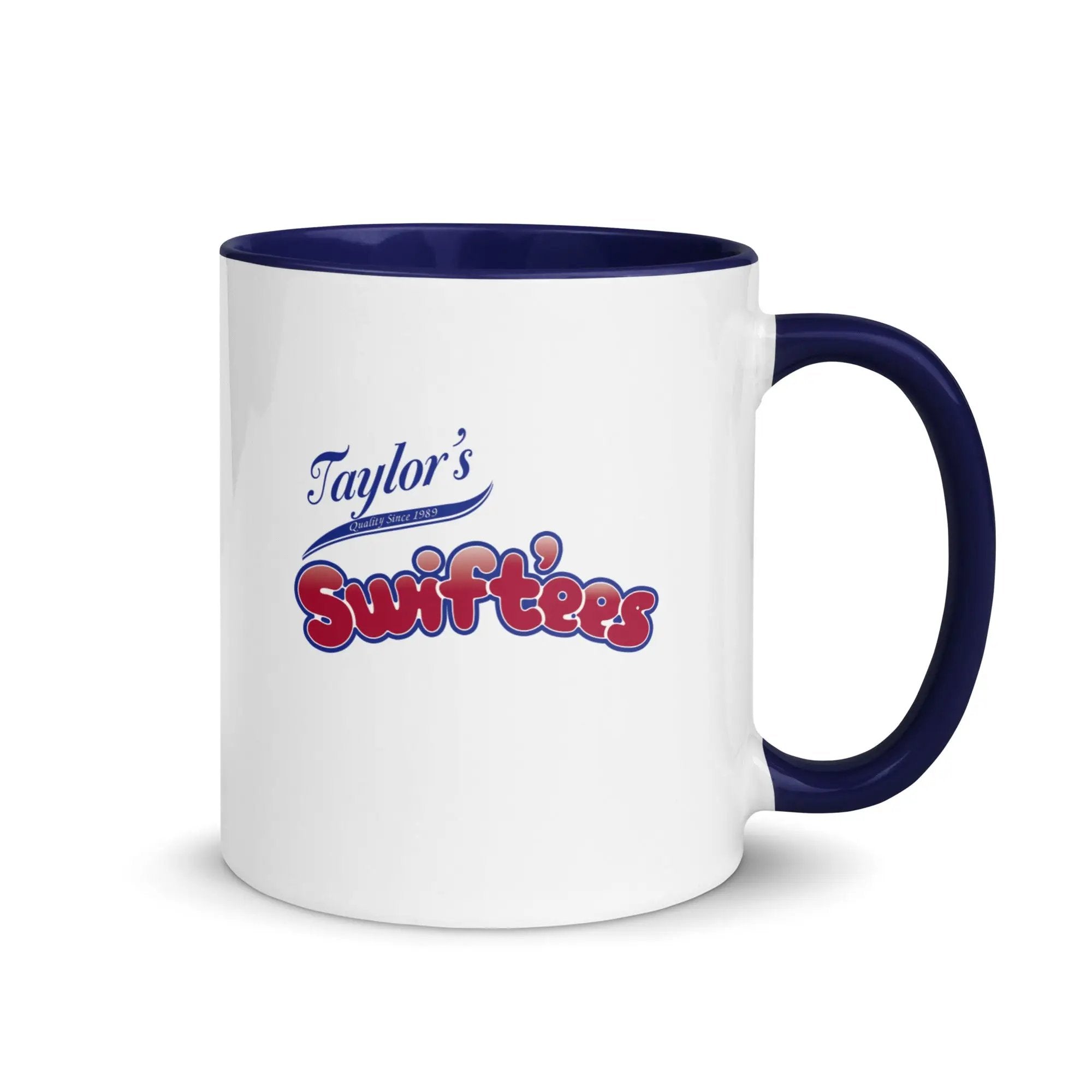 a white and blue coffee mug with taylor's swiftfeasts on it
