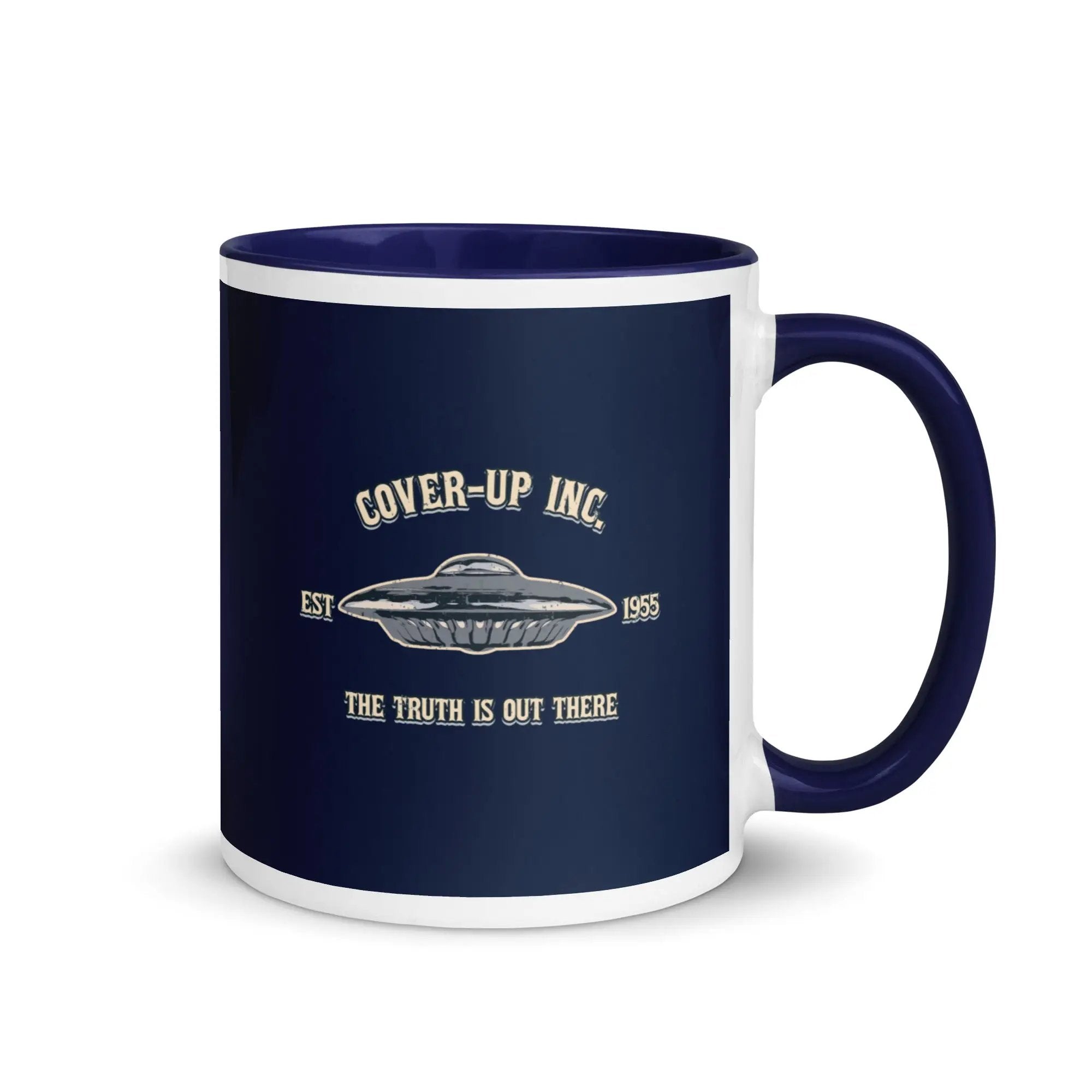 a blue and white coffee mug with the words cover - up inc on it