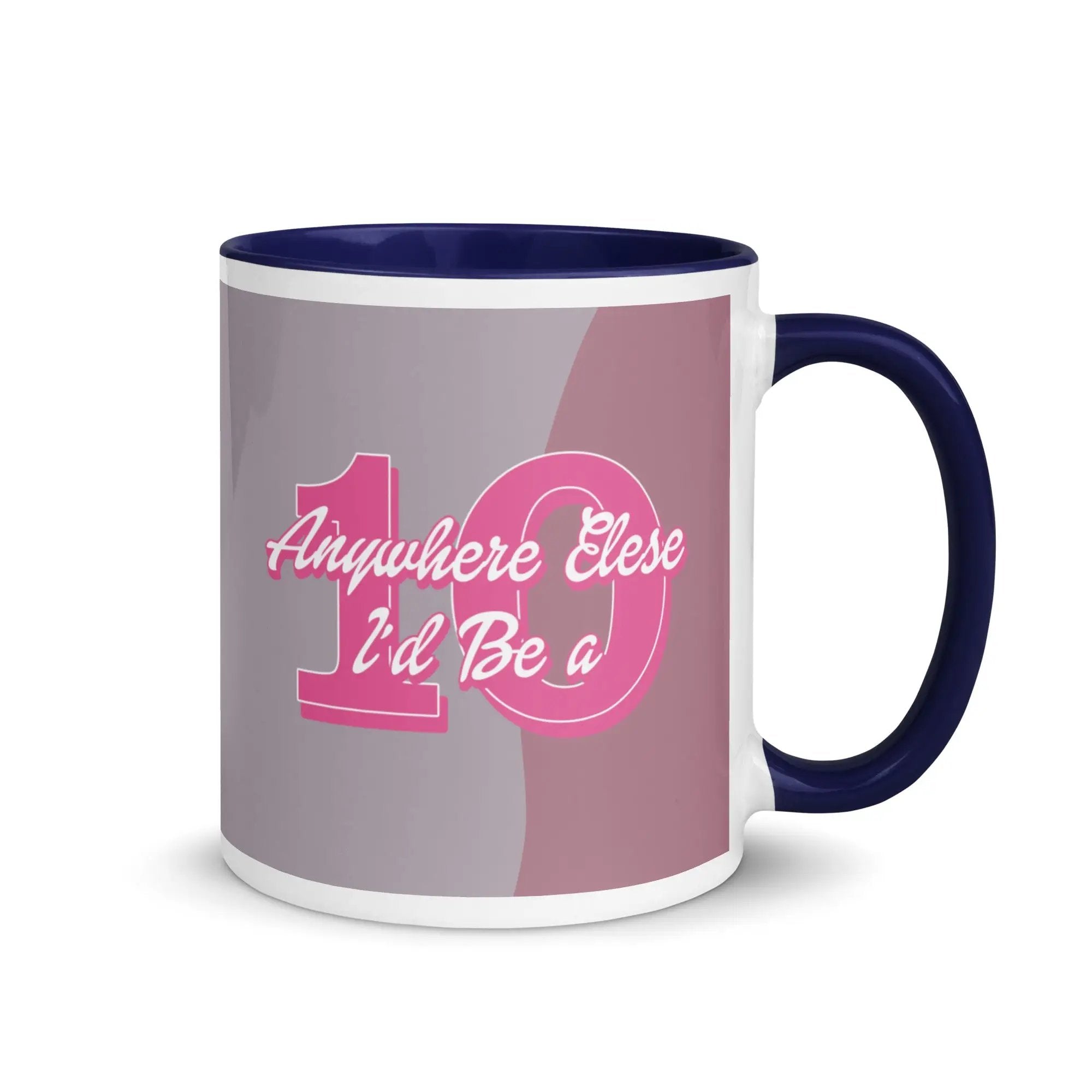 a blue and white coffee mug with a pink and grey handle
