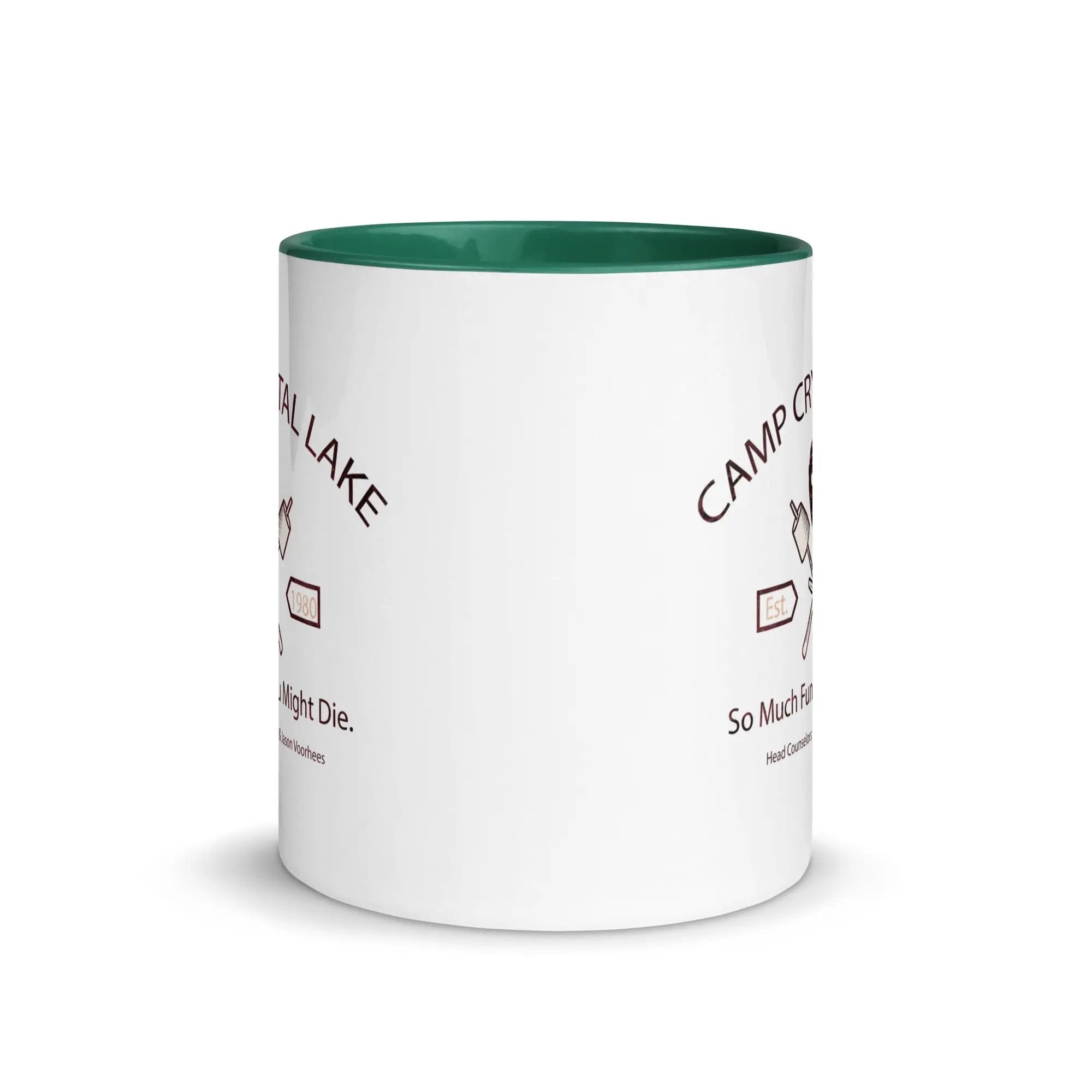 a white coffee mug with a green rim