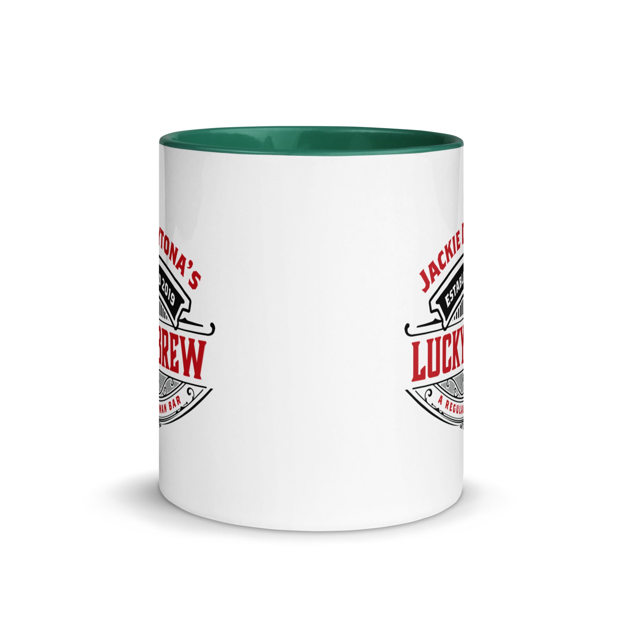 a white coffee mug with a green rim