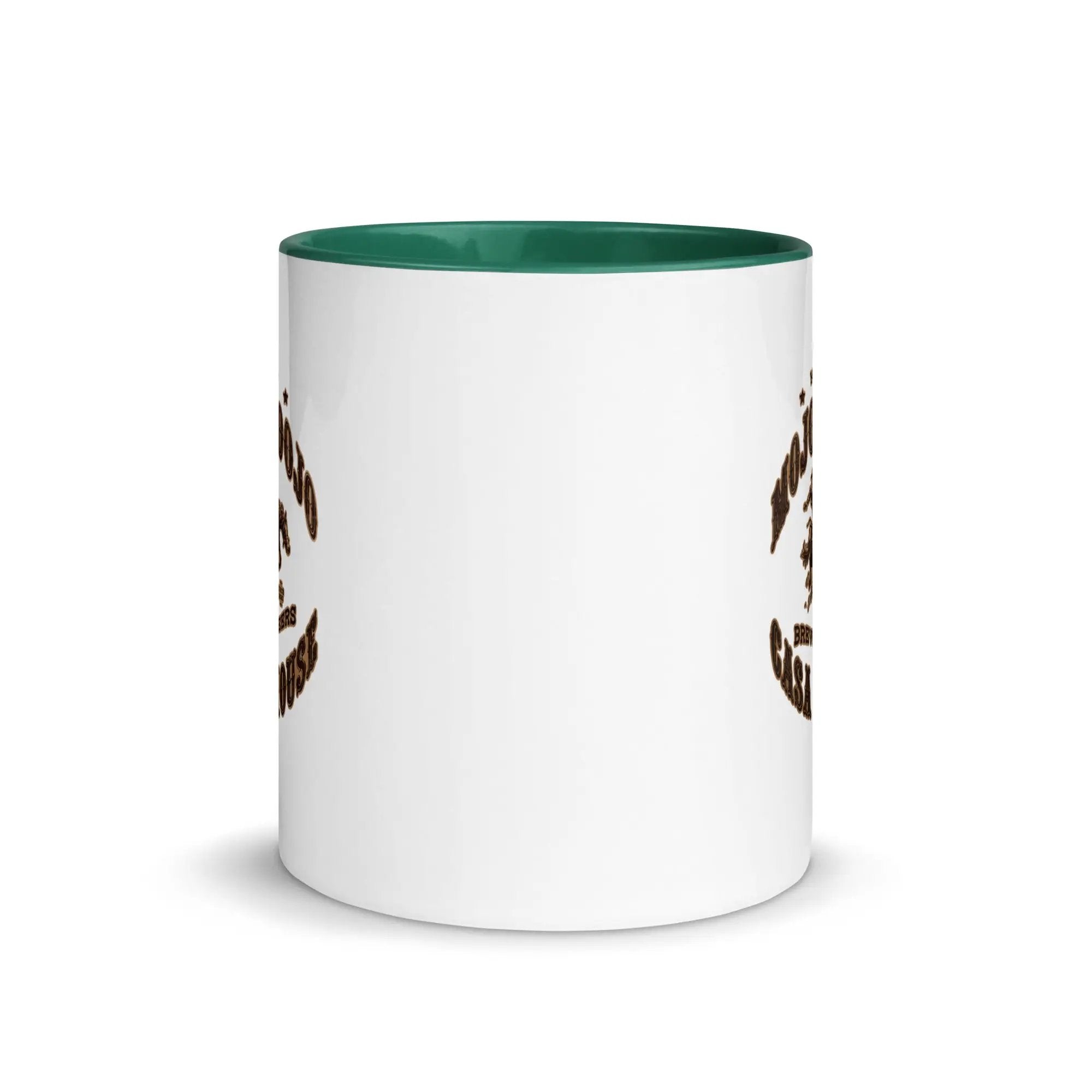 a white and green coffee mug with a brown and white design