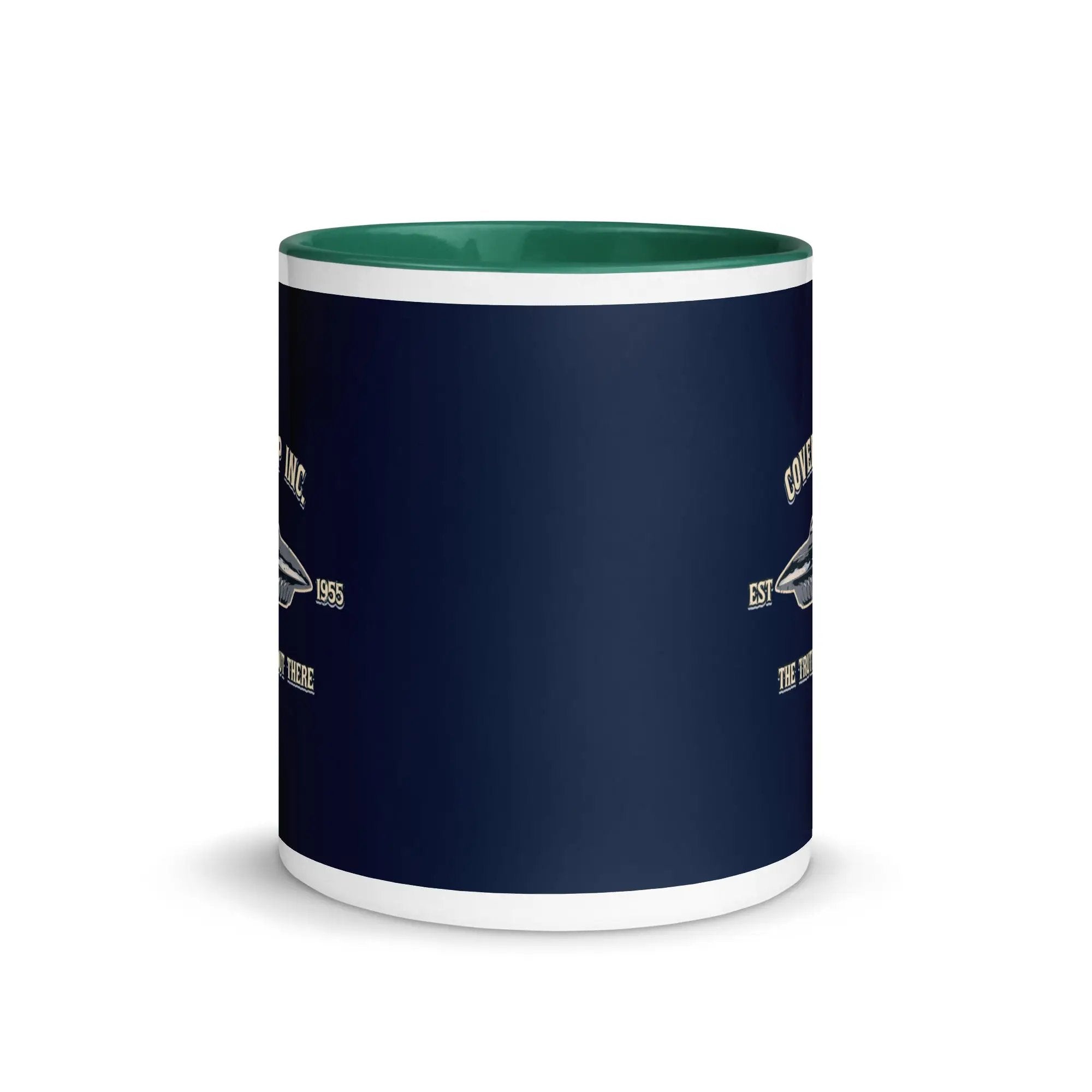 a blue and white coffee mug with a green rim