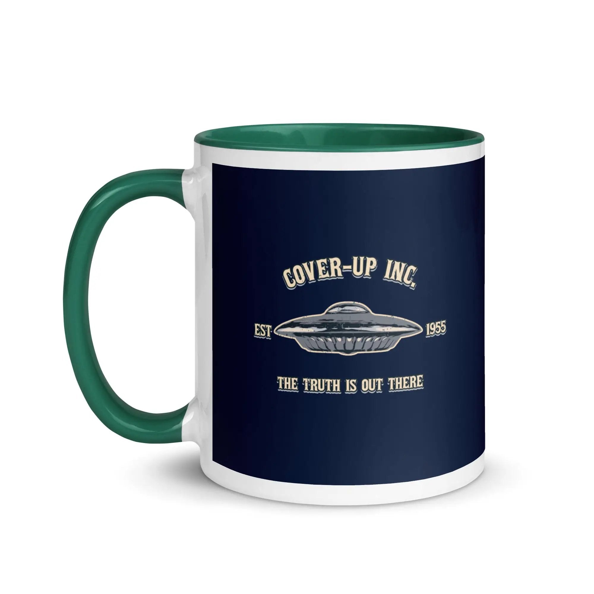 a green and white coffee mug with the words cover - up inc on it