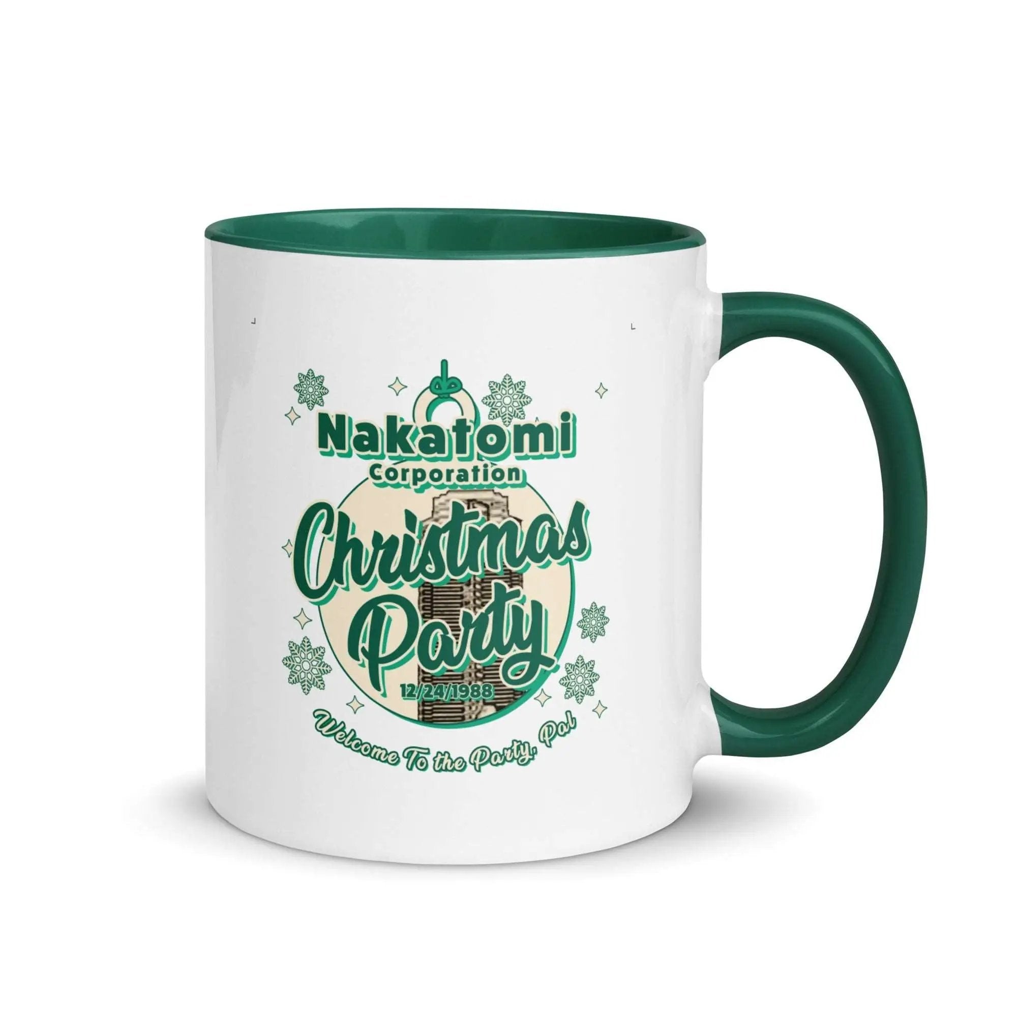 a white and green coffee mug with a green handle